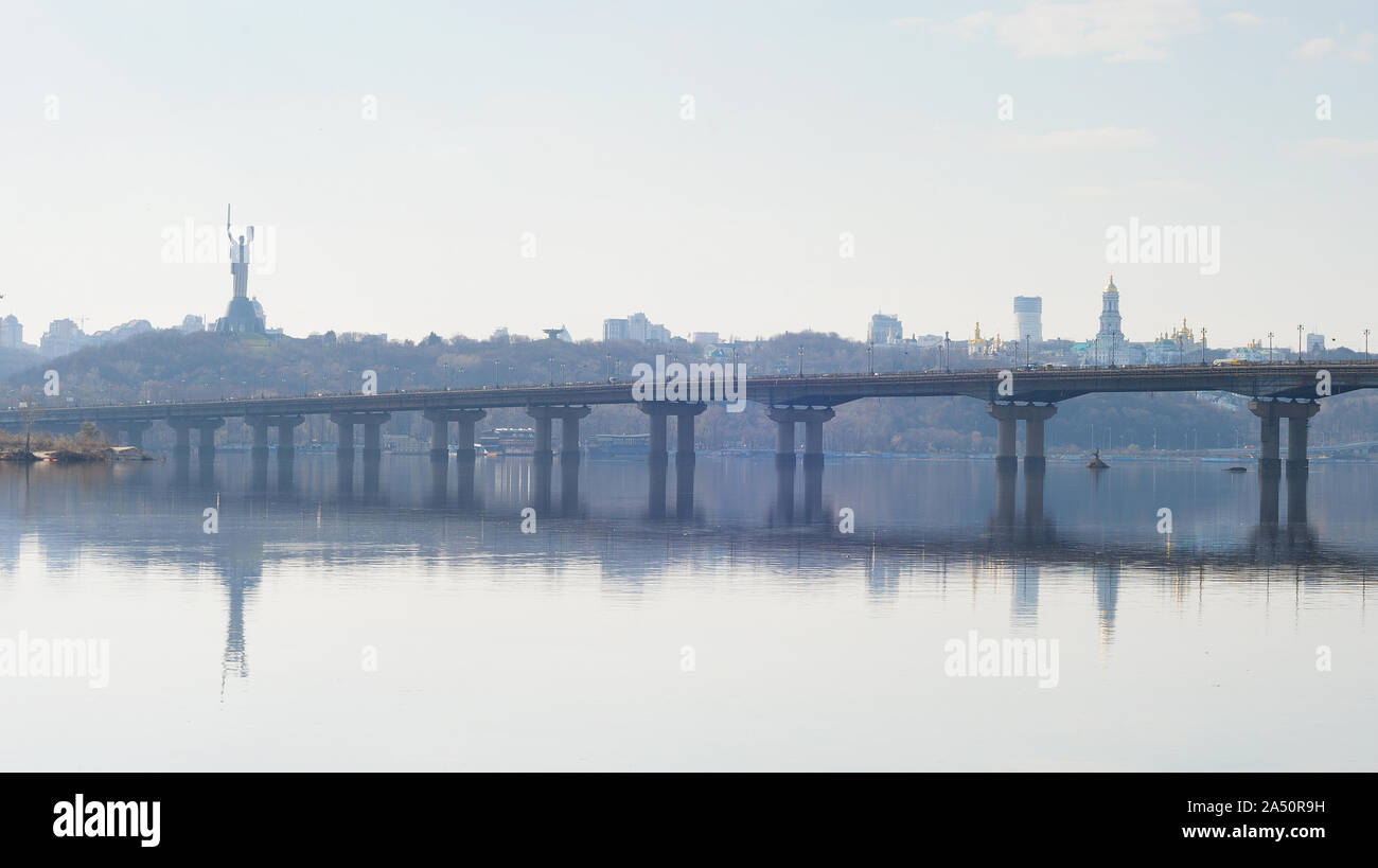 Panoramic view of Mother Motherland monument above Dnipro river with Paton bridge and Kiev city skyline, Ukraine Stock Photo