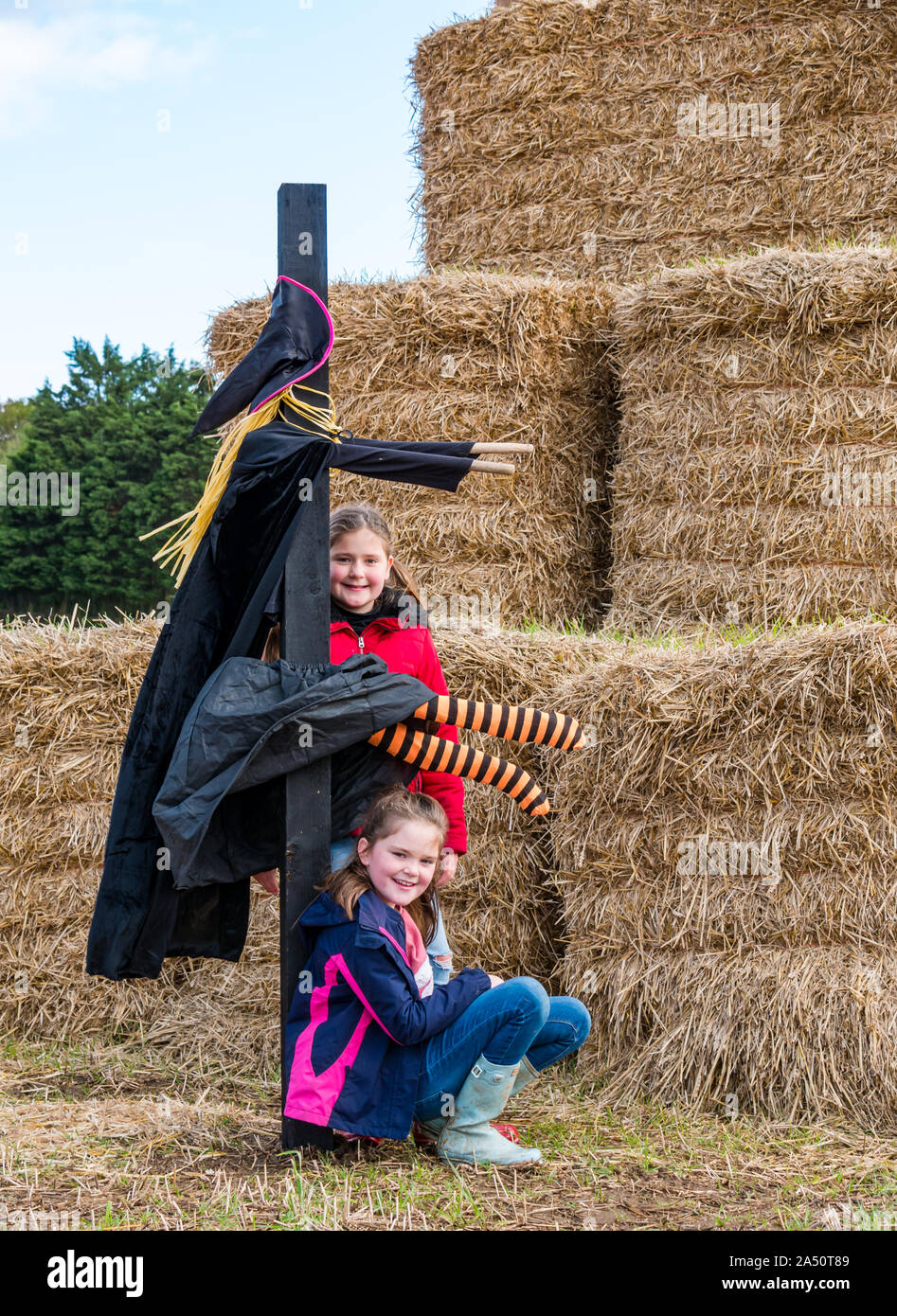 Kilduff Farm, East Lothian, Scotland, United Kingdom, 17 October 2019. Pumpkin Patch:  Maisie (10 years) and Louisa (8 years) Calder at the hay bale maze Stock Photo