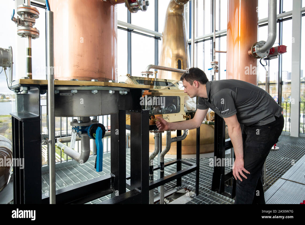 Andrew Fraser, distillery operator, checks the spirit safe in the still house at the Clydesdale Distillery, Glasgow. PA Photo. Picture date: Thursday October 17, 2019. International Trade Secretary Liz Truss has urged Donald Trump to reverse tariffs on key exports such as Scotch Whisky. The World Trade Organisation (WTO) has given the US the green light to impose tariffs on up to 7.5 billion dollars (??6.1 billion) of goods from the European Union. See PA story COMMONS Trade. Photo credit should read: Jane Barlow/PA Wire Stock Photo