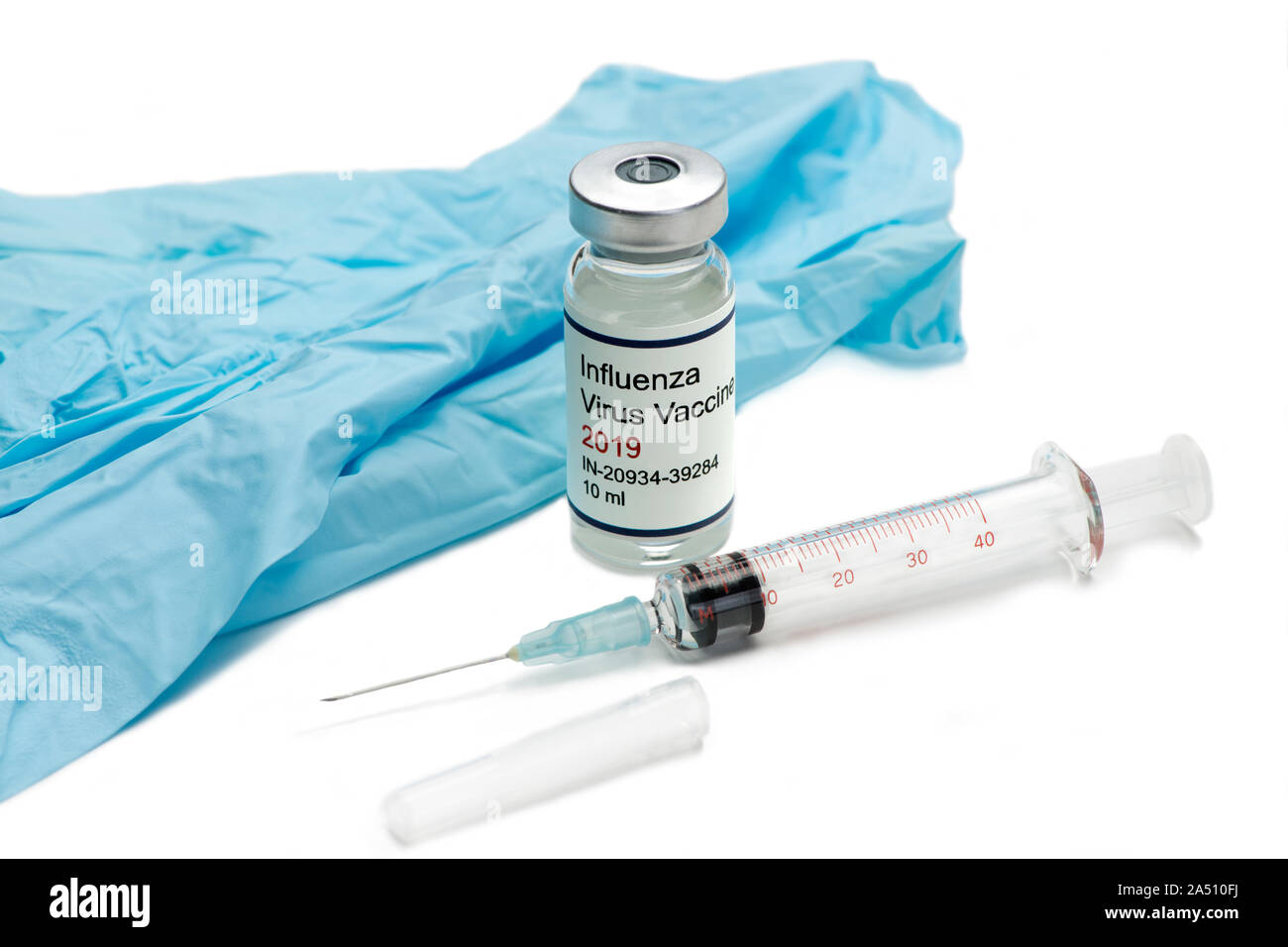 2019 Flu vaccine vial with syringe and gloves on white Stock Photo - Alamy