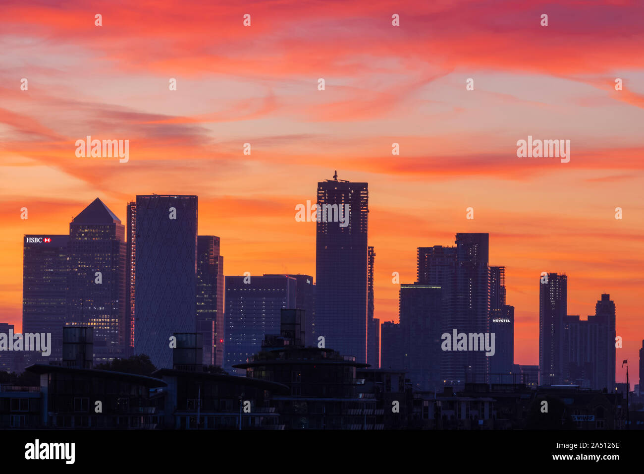 England, London, Docklands, Silouette of Canary Wharf Skyline at Dawn Stock Photo