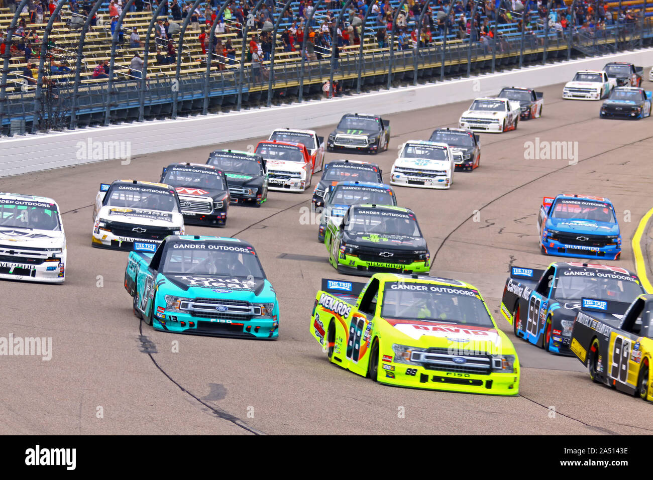 Newton, Iowa - June 15, 2019: Gander Outdoors Truck Series group of racing trucks, pack on Iowa Speedway, at the M&M'S 200 Presented by Casey's Genera Stock Photo