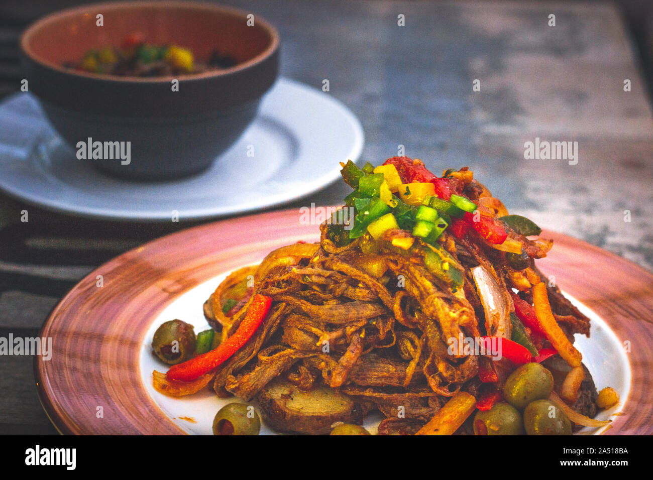 Ropa Vieja Shredded flank steak, vegetable in tomato sauce and Arroz Moro Stock Photo