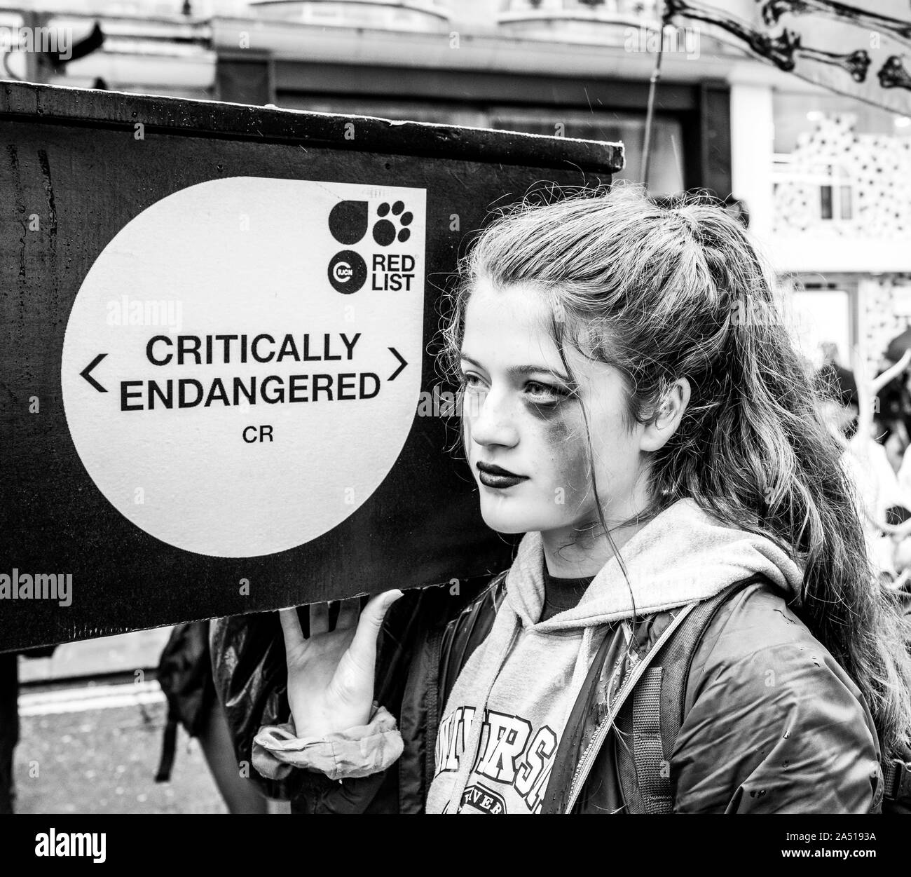 Extinction Rebellion youth Protester carries coffin for endangered species - London October 2019 Stock Photo