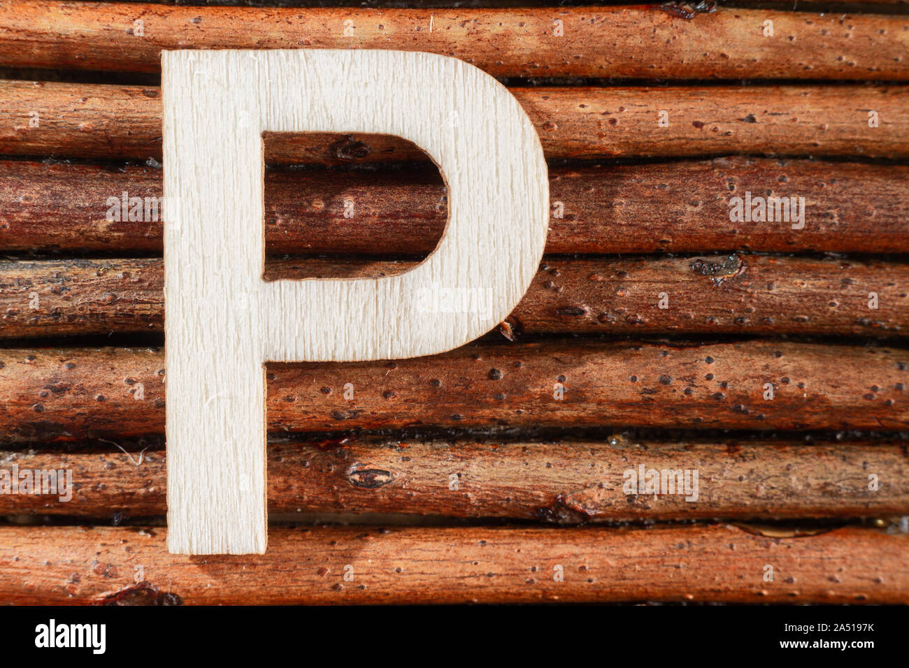 Letter P of wood-made alphabet, top view and space for text Stock Photo