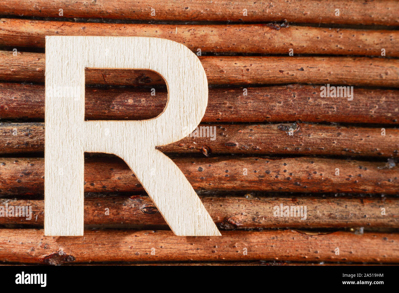 Letter R of wood-made alphabet, top view and space for text Stock Photo ...