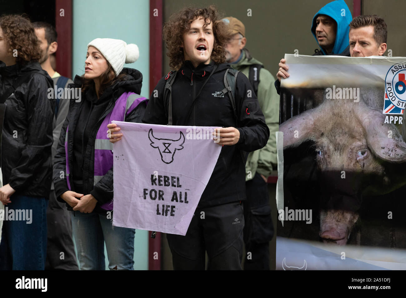 London. UK. 17 October 2019. Extinction Rebellion protesters from the Animal Rebellion vegan wing demonstrate outside and opposite the offices of the Red Tractor Assurance offices in central London. The Red Tractor is a food assurance scheme that looks at production standards on safety, hygiene, animal welfare and food production. Credit: Alamy Live News Stock Photo