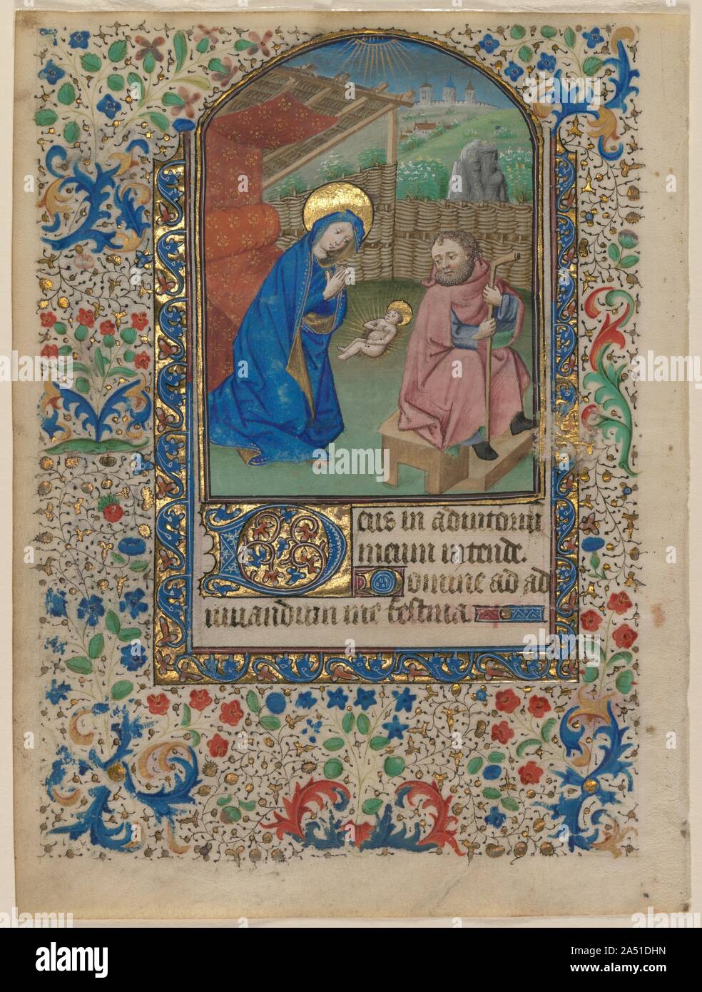 Leaf from a Book of Hours: The Nativity (recto) and Text (verso), c. 1430. Representing God's entry into the world, the Nativity remains one of medieval painting's most poignant Christian images. In the Gospels, only Matthew and Luke directly described this event. Perhaps the brevity and absence of detail in these texts allowed artists to devote so much creativity to amplifying the Christmas story. This miniature's simplicity makes it compelling. Only the three principals&#x2014;Mary, Joseph, and the newly born Christ Child&#x2014;appear in the scene. The Virgin kneels before an elegant canopi Stock Photo