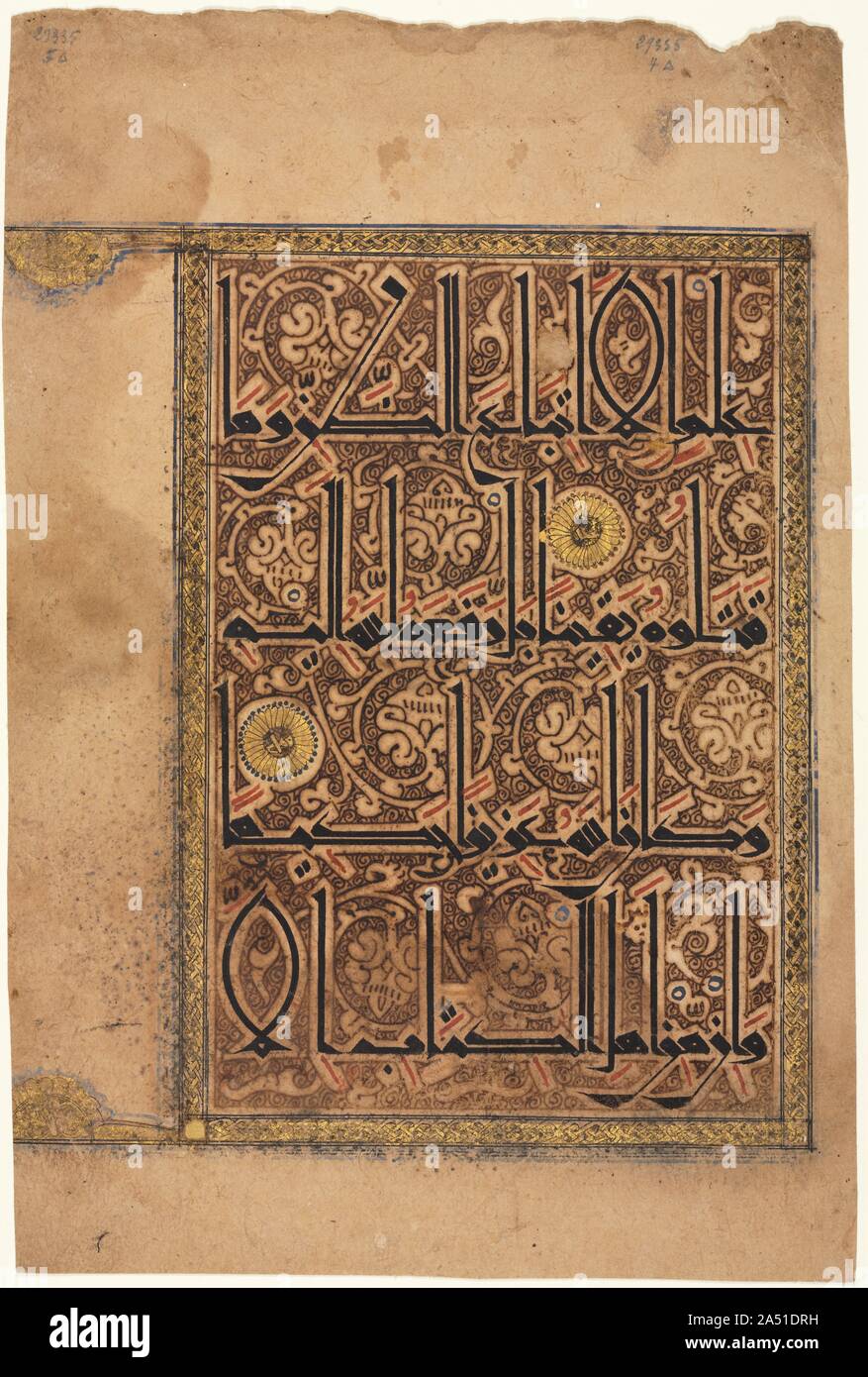 Leaf from a Koran, 1100s. Arabic calligraphy, the art of beautiful writing, was elevated above all other art forms in the Islamic world because Allah, or God, revealed the divine word of Islam to the Prophet Muhammad (570-632) in the Arabic language. This Koran page is considered one of the most splendid examples of Arabic calligraphy. Based on the proportions of Arabic letters, majestic eastern Kufic script features attenuated letters with long upstrokes and low strokes swaying to the left. Contours echoing the letters separate the sacred text from the lively arabesque background. This vertic Stock Photo