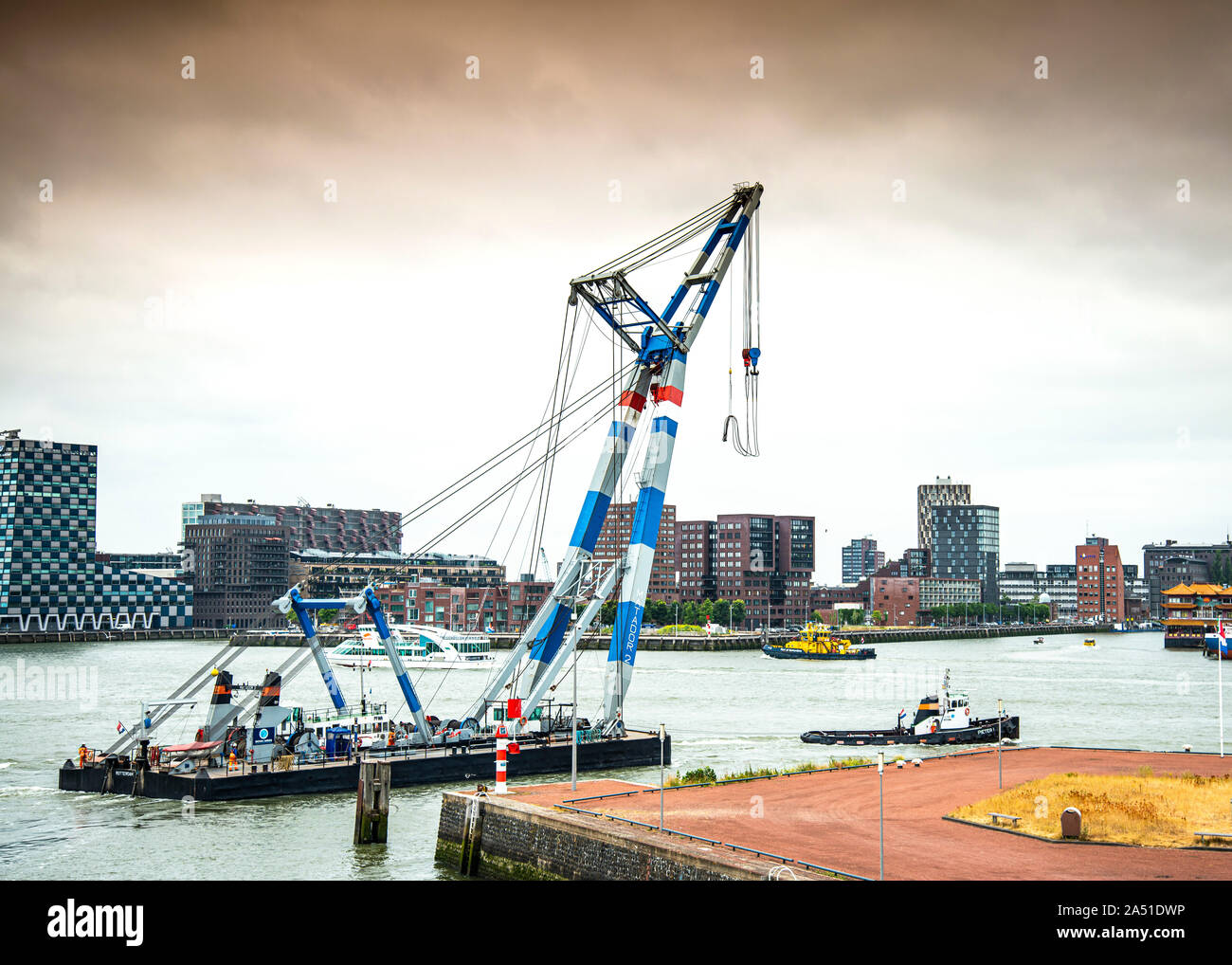 Matador 2 large floating non propelled crane used lifting heavy industrial parts,working in the port of Rotterdam,and offshore wind turbine projects. Stock Photo