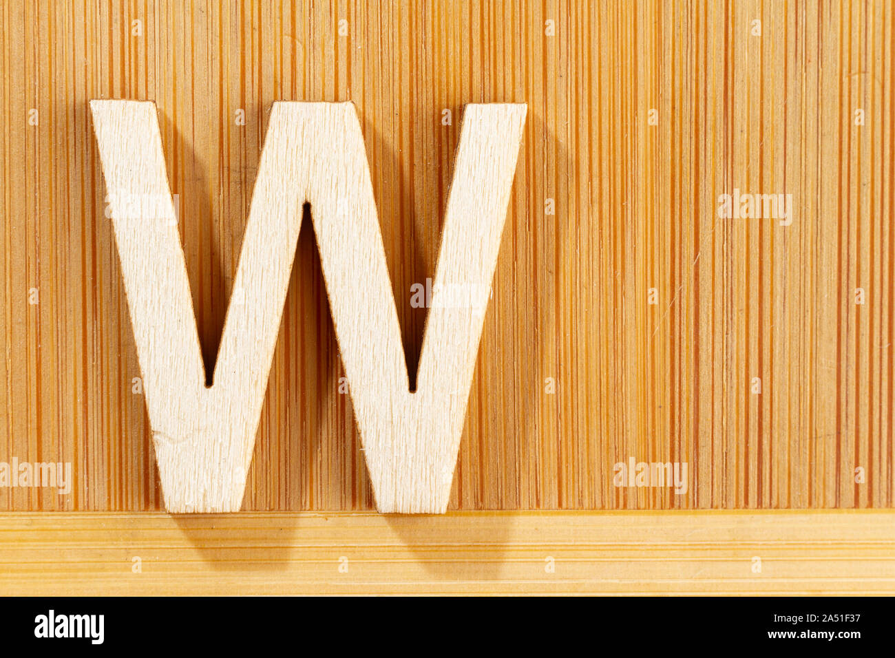 Letter W of wood-made alphabet, top view and space for text Stock Photo ...