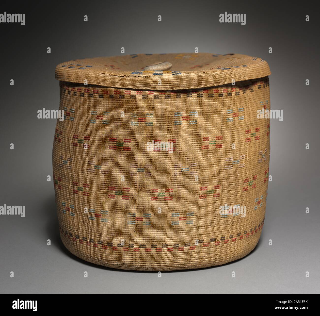 Lidded Twined Cylindrical Basket, late 1800 - early 1900. Stock Photo