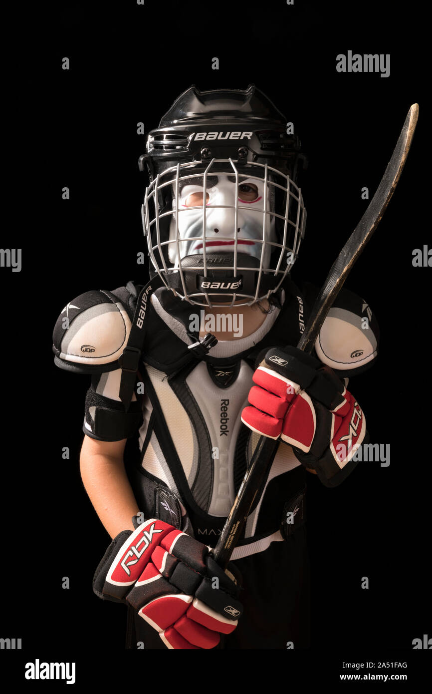 boy dressed in Halloween costume in hockey outfit Stock Photo