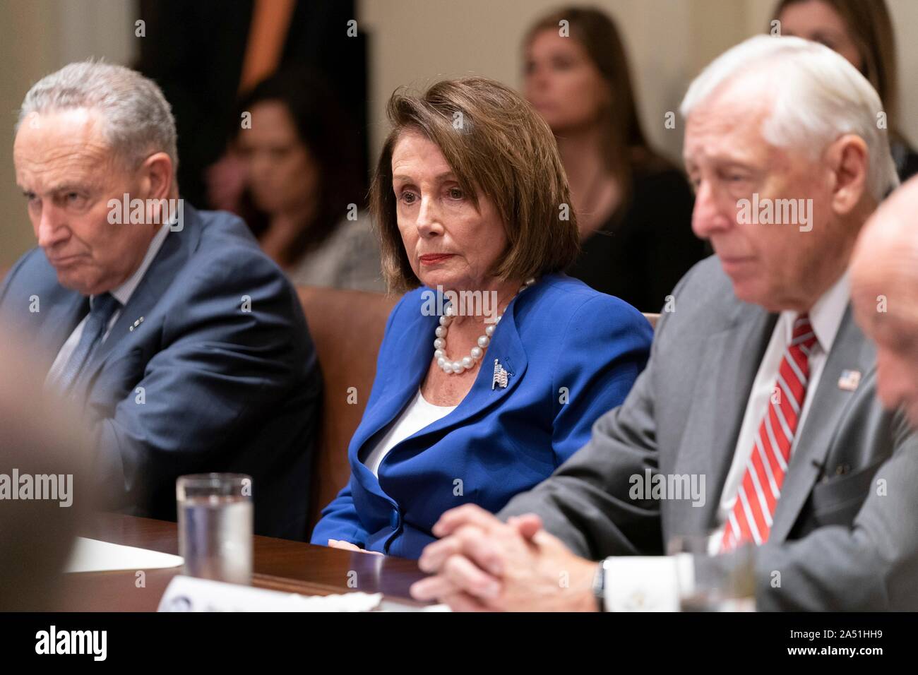 Washington, United States of America. 16 October, 2019. U.S Speaker of the House Nancy Pelosi, center, with Senate Minority Leader Chuck Schumer, left, and House Majority Leader Steny Hoyer, right, during a meeting on Kurdish crisis in the Cabinet Room of the White House October 16, 2019 in Washington, DC. The meeting called by the president to discuss the crisis along the Syrian - Turkey border devolved into a confrontation before the Speaker walked out.   Credit: Shealah Craighead/White House Photo/Alamy Live News Stock Photo