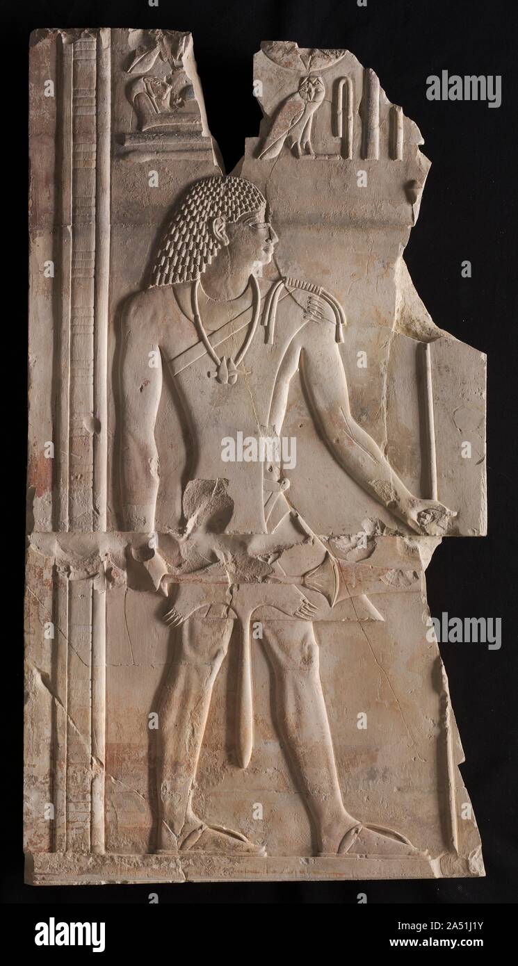 Mentuemhat as Priest with Staff and Scepter, c. 667-647 BC. Mentuemhet in his robes as a priest of Amen and carrying the wand used to consecrate food offerings to the god. Raised relief in the style of his time, but showing some influence of Middle Kingdom work. Stock Photo