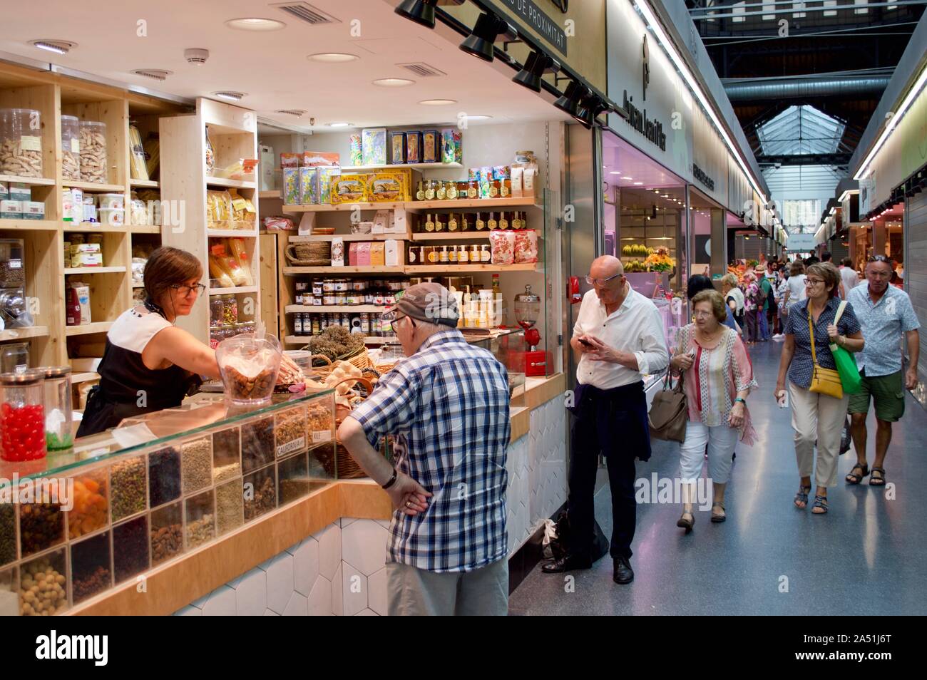 People buying food at Sant Antoni Market in Barcelona, Spain Stock Photo