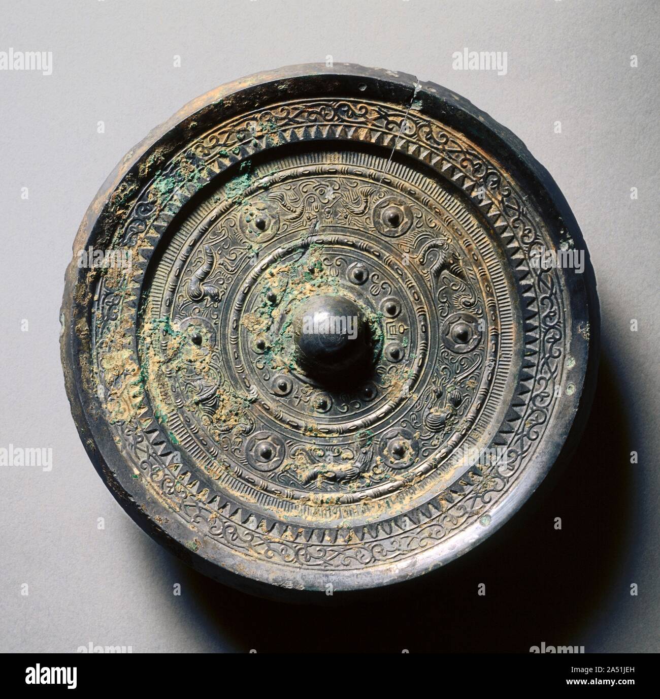 Mirror with Concentric Circles, an Immortal, and Auspicious Animals, 1st century. Mirror with Concentric Circles, an Immortal, and Auspicious Animals, 1st century ad China, Eastern Han dynasty (ad 25-220) CMA 1995.304 [Cat. no. 23] Stock Photo