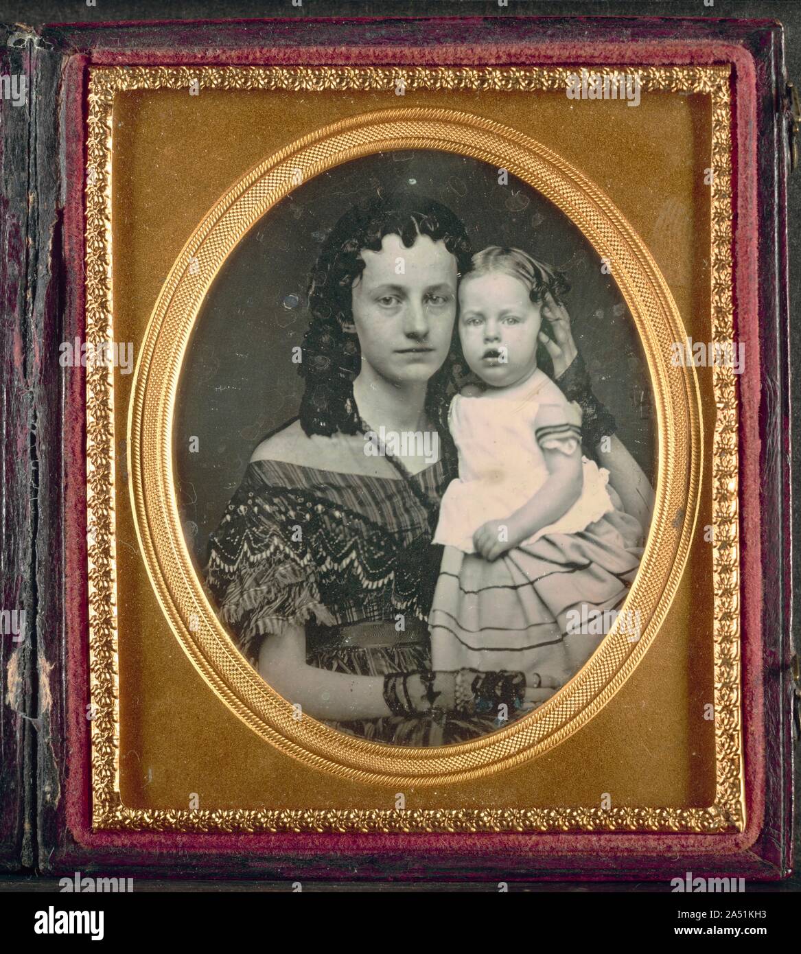 Mother and Child, c. 1855. Some of the most inventive and technically skilled practitioners in the early history of photography are as yet unidentified. However, with time more of these individuals will probably be recognized by name. Introduced into America soon after its invention in 1839 by the Frenchman Louis-Jacques-Mand&#xe9; Daguerre, the daguerreotype flourished from 1840 to the mid-1860s. This beautiful daguerreotype in its original case is an outstanding example of a very popular subject: mother and child. The polished silver plate precisely renders in warm tones the likeness of the Stock Photo