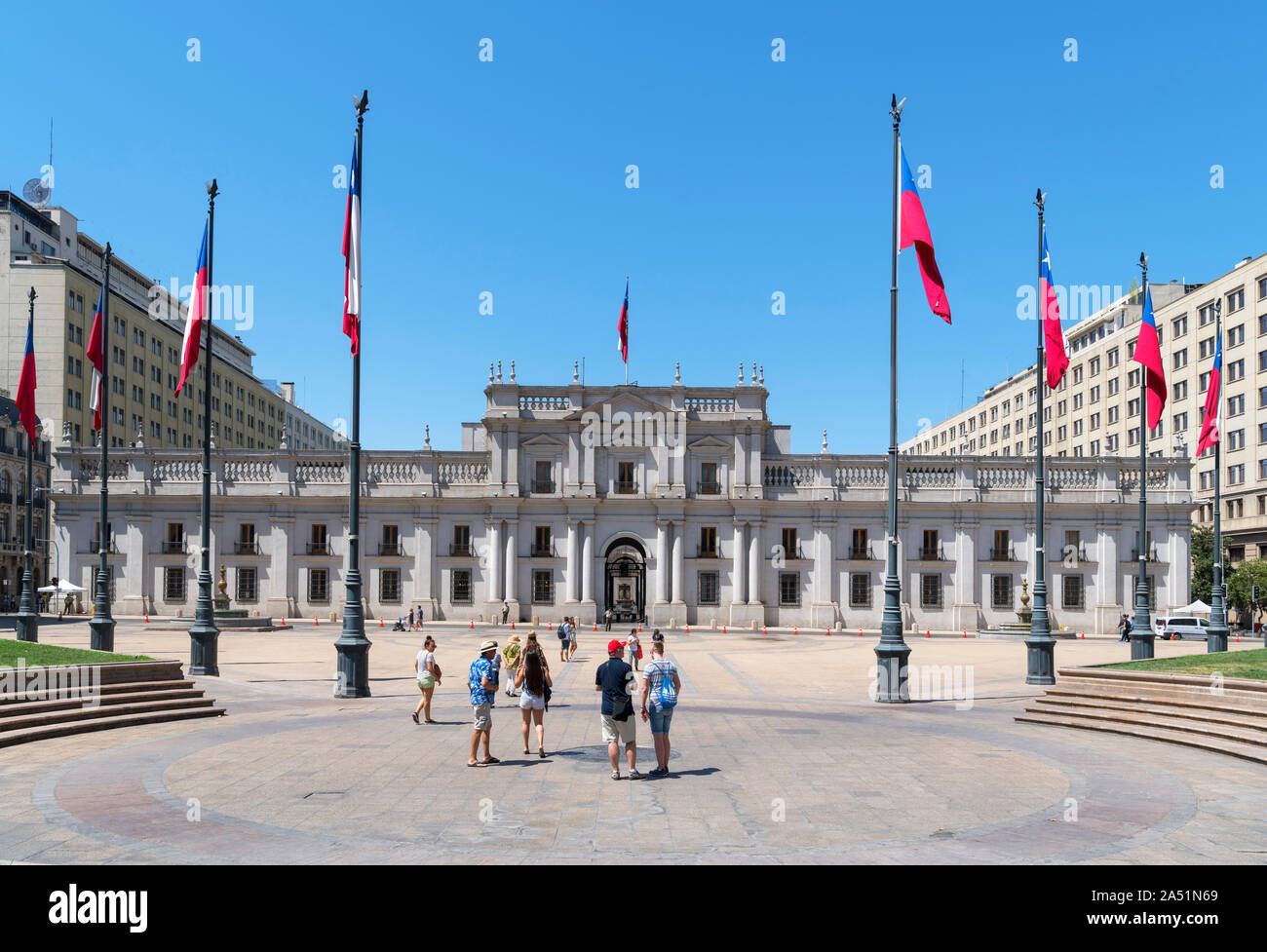 La Moneda Palace, Santiago. Tourists in front of the Palacio de la Moneda, seat of the President of Chile, Santiago, Chile, South America Stock Photo
