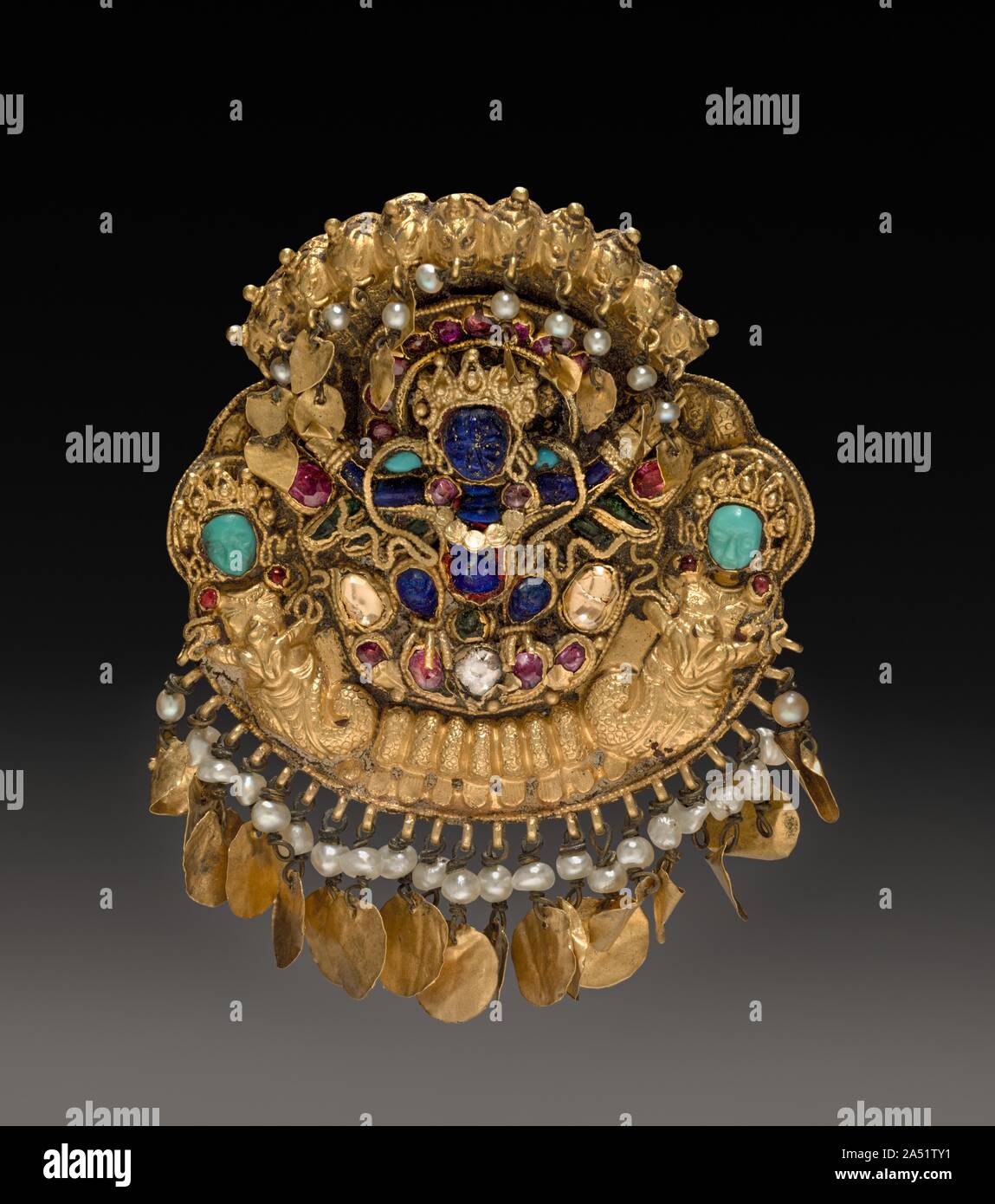 Pendant with Two-Armed Blue Deity on a Lotus with Nagas (serpent divinities), 1600s or 1700s. Stock Photo