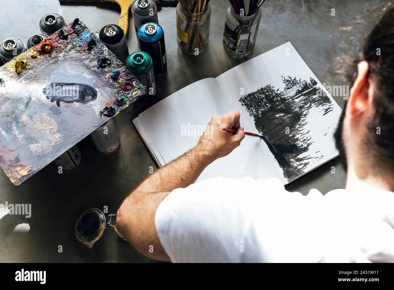 Young artist man painting on hi-res stock photography and images - Alamy