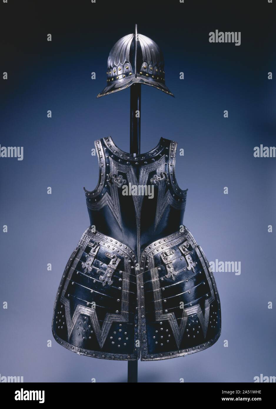 Pikeman&#x2019;s Armor, c. 1620-1630. Pikemen formed the backbone of infantry tactics through the end of the English Civil Wars (1642-51). Since muskets alone were ineffective against cavalry charges, companies of pikemen, armed with pikes, or spears, of 12 to 16 feet in length, were deployed in defensive formations to protect the musketeers, who wore no armor. A pikeman was usually equipped with a breastplate and backplate, hinged tassets reaching to mid-thigh, and sometimes a gorget, or neck piece, worn over a heavy buffcoat. High boots replaced leg armor. A brimmed, high-combed helmet known Stock Photo