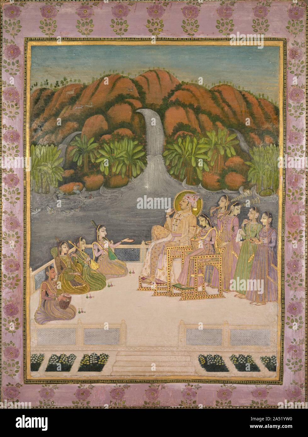 Portrait of Sardar Singh (Son of Savant Singh, 1730-68), c. 1760. The ruler of the princely state of Kishangarh chose to have himself depicted in an intoxicatingly paradisiacal setting. He and his queen occupy jeweled chairs on a white marble terrace with formal flower gardens overlooking a lake. They listen to a musical performance while female attendants stand ready to whisk away flies and serve tiny bottles liquor. The fresh palette and dramatically elongated eyes, especially on the women, are hallmarks of the most celebrated works from this Rajput court. The king is portrayed with less exa Stock Photo