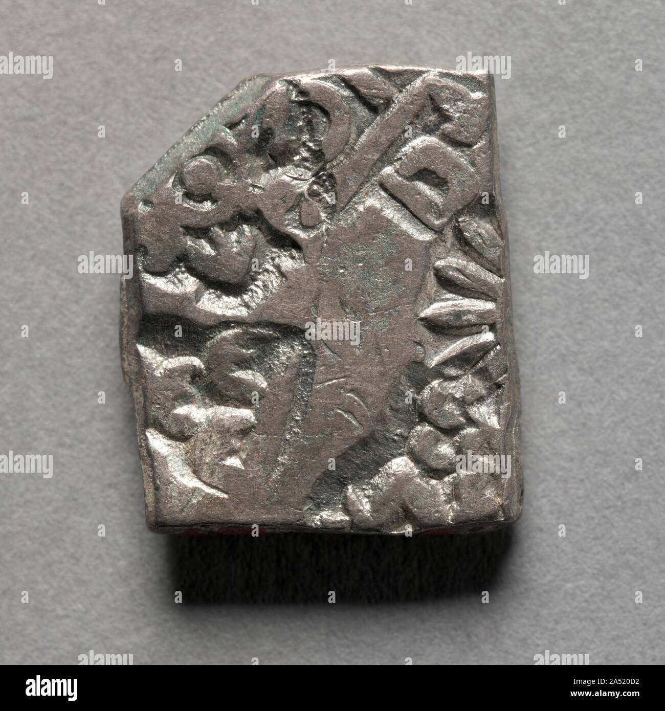 Punch-Marked Coin, 400-300 BC. After Alexander of Macedon succeeded in conquering Egypt and Persia in 331 BC, his ambition to rule the known world led him further east across Bactria in Afghanistan, through the Hindu Kush mountain pass, and into India. There he succeeded in defeating all the local kings of the region until his men, on the brink of mutiny, insisted that they return to Greece. Alexander left governors in charge of his territories, and after his death in 323 BC, his governors became independent kings, establishing Hellenistic cities and a Greek cultural base in the region, which Stock Photo