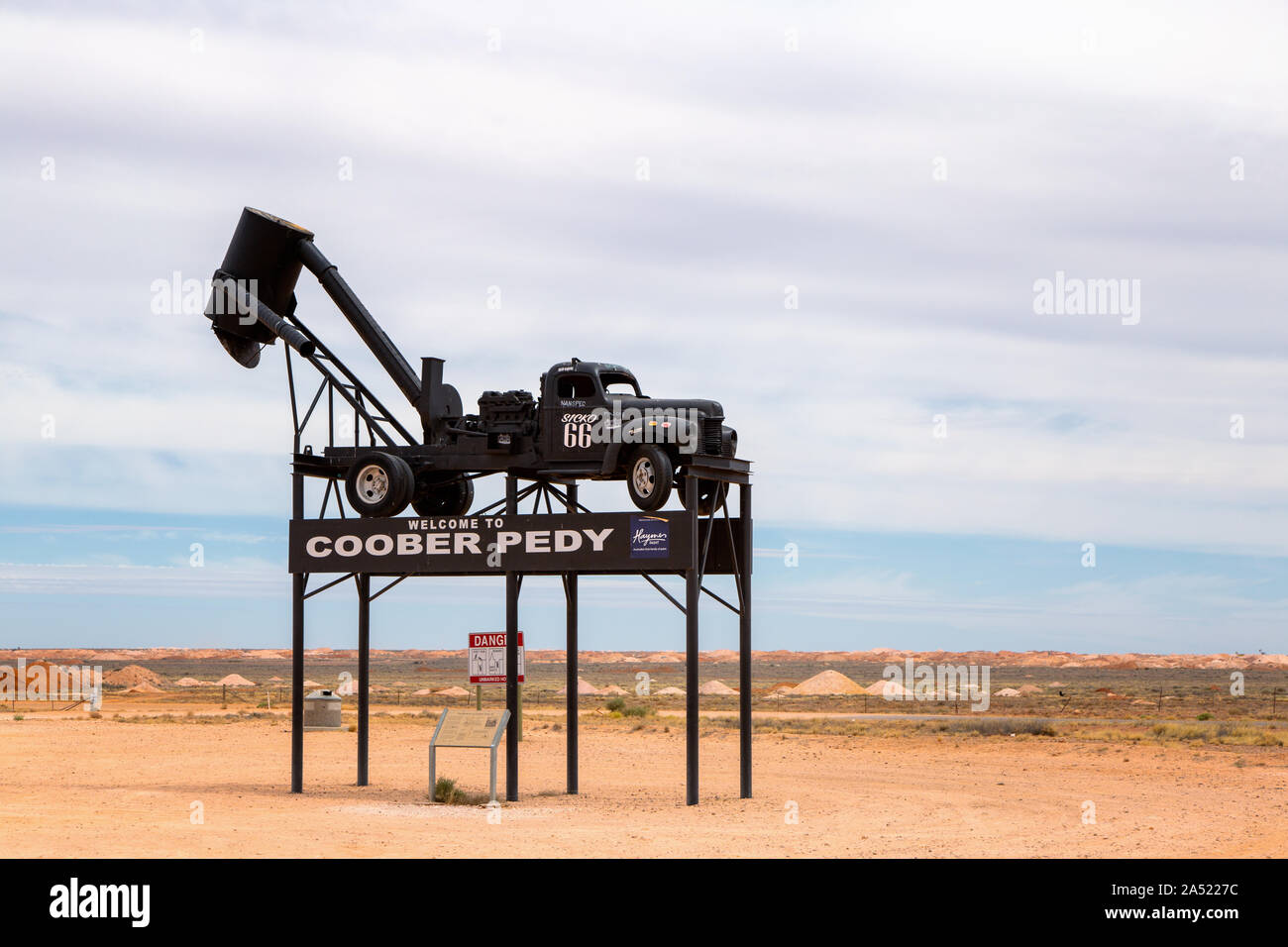Welcome to Coober Pedy, Mininig truck on stilts as sight along the Stuart Highway in Coober Pedy, South Australia, Australia, Stock Photo