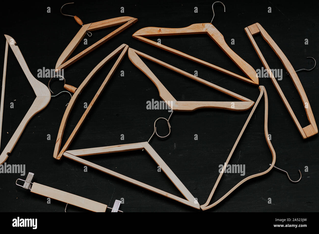 Vintage clothing hangers on a black background Stock Photo Alamy