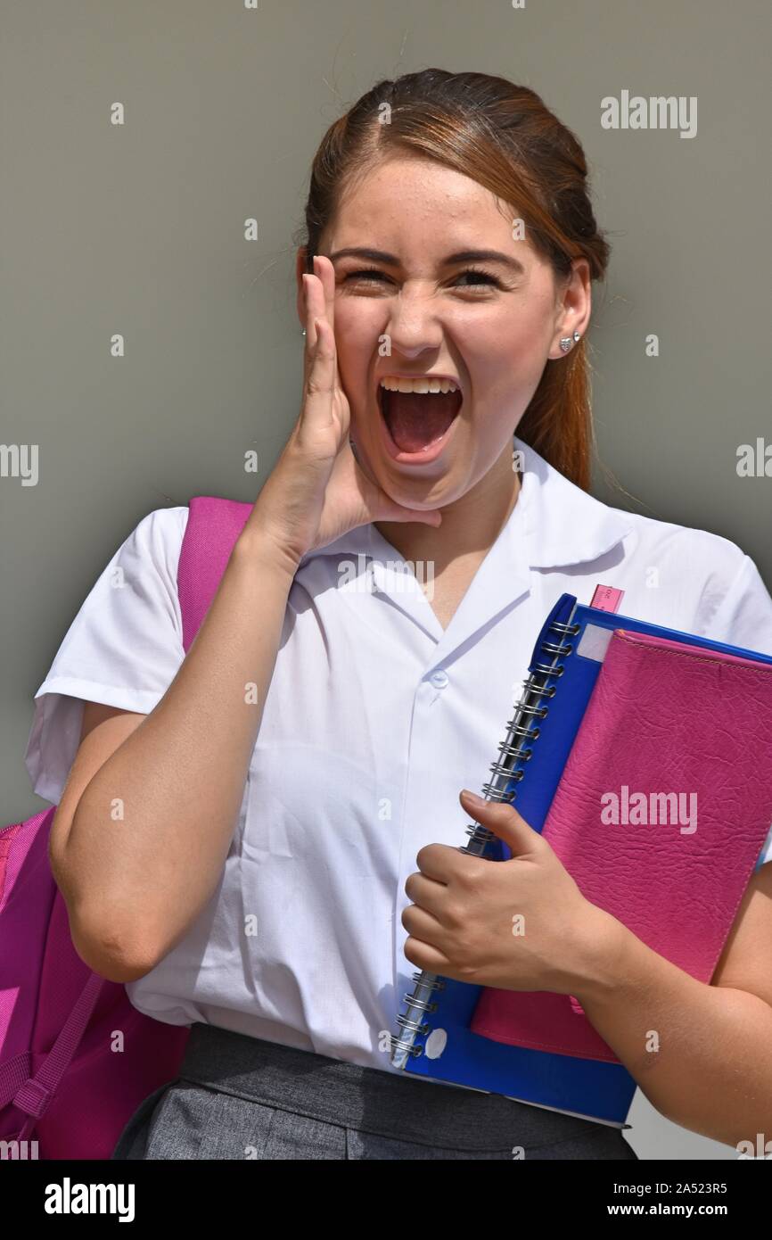 Colombian School Girl Yelling With Books Stock Photo