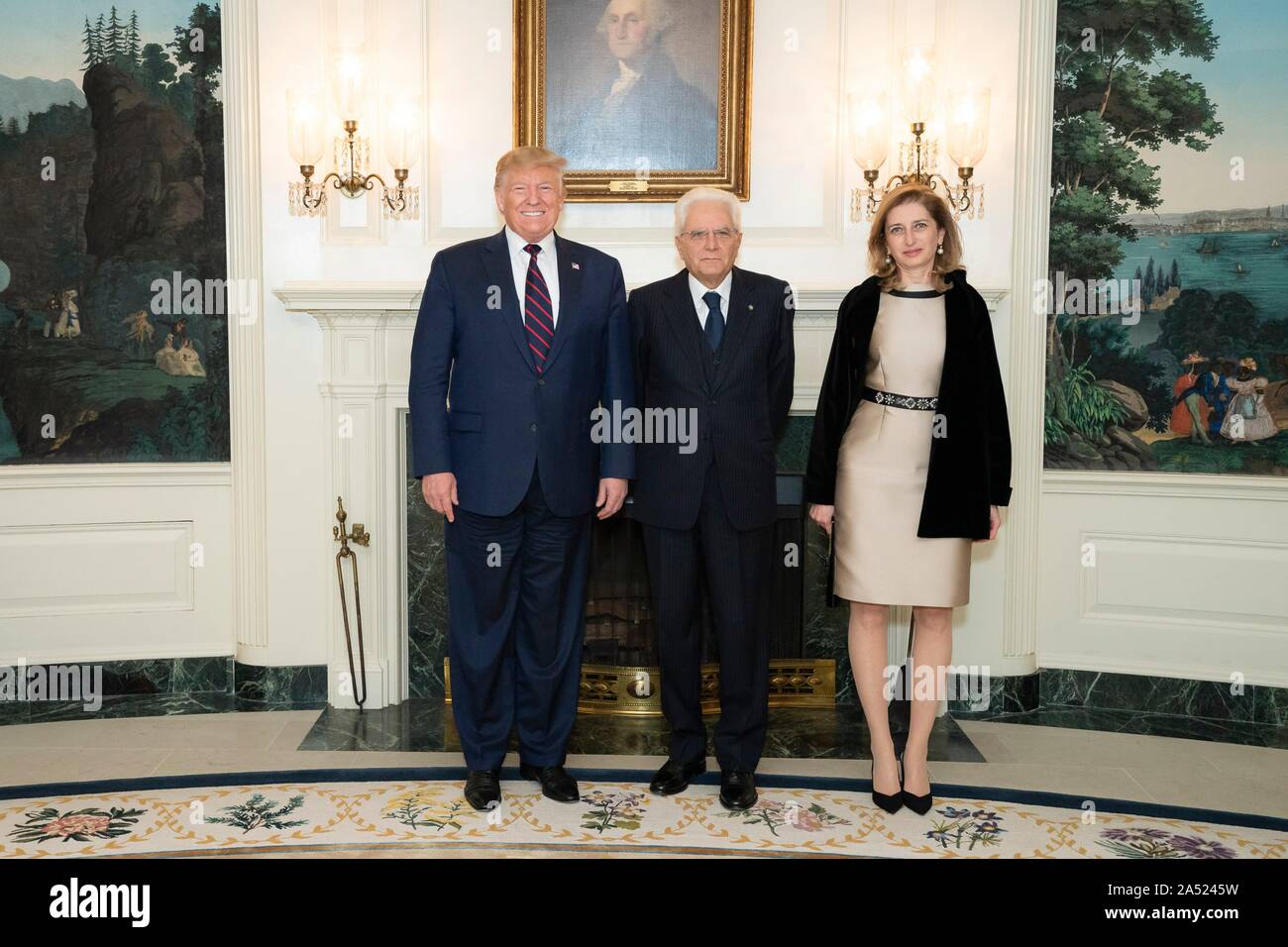 Washington, United States of America. 16 October, 2019. U.S President Donald Trump, left, poses with Italian President Sergio Mattarella, center, and and his daughter Laura Mattarella in the Diplomatic Reception Room of the White House October 16, 2019 in Washington, DC. Credit: Tia Dufour/White House Photo/Alamy Live News Stock Photo