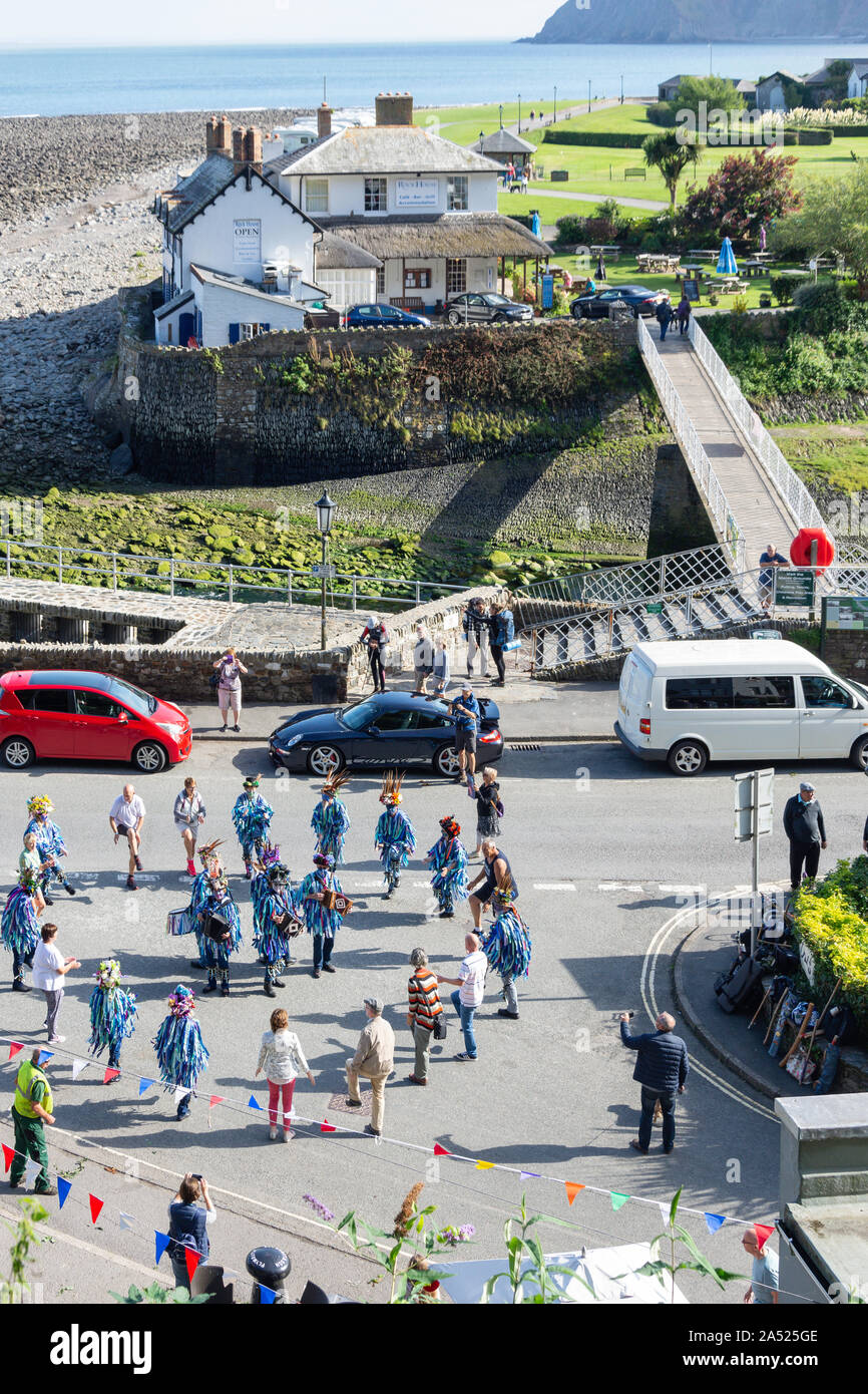 Morris dancing troupe performing on Harbourside, Lynmouth, Devon, England, United Kingdom Stock Photo