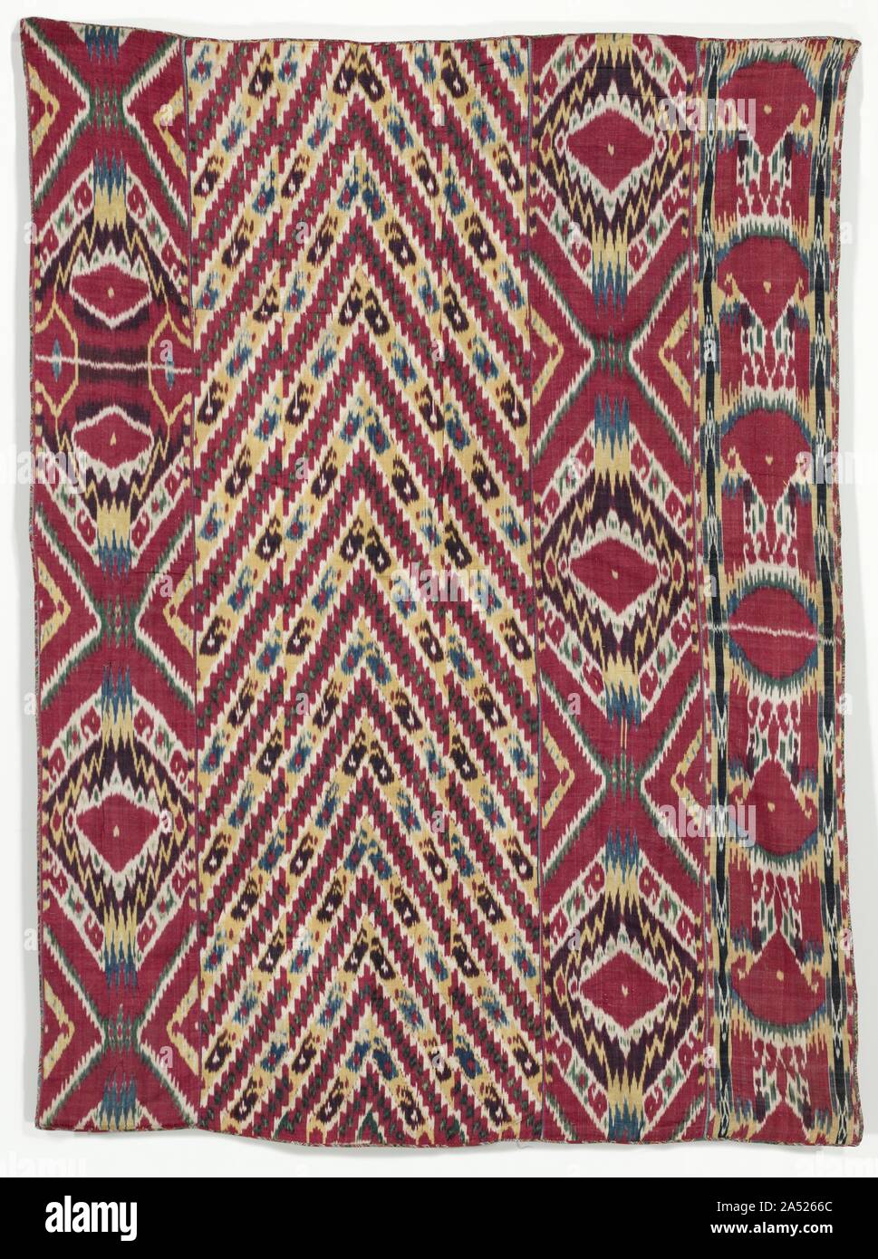 Silk Ikat Wall Hanging (#333), third quarter of the 1800s. Eye-dazzling patterns with saturated colours demonstrating the ikat technique provided vibrant wall hangings for the reception rooms of the urban elite in Central Asia. In this splendid example comprising five loom widths, three lengths display popular amulet designs while the two inner lengths are precursors to the bold chevron designs of the late 19th century. The irregular contours&#x2014;tell-tale indicators of ikat&#x2014;are masterfully controlled with five rich colours. In the ikat technique, designs are dyed on the warp (vertic Stock Photo