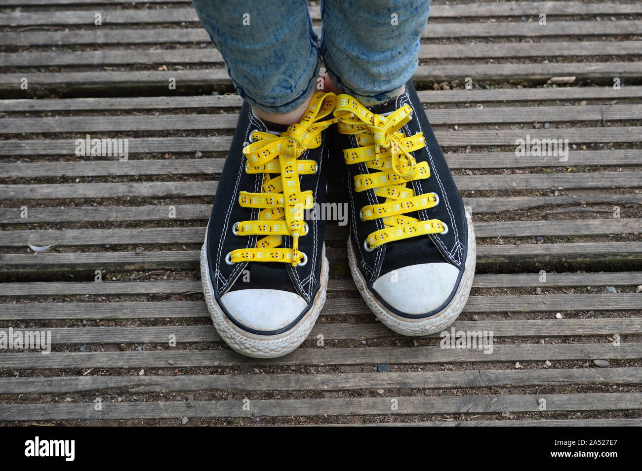 Bold Portrait of converse shoes that have been updated with some new  creative laces Stock Photo - Alamy