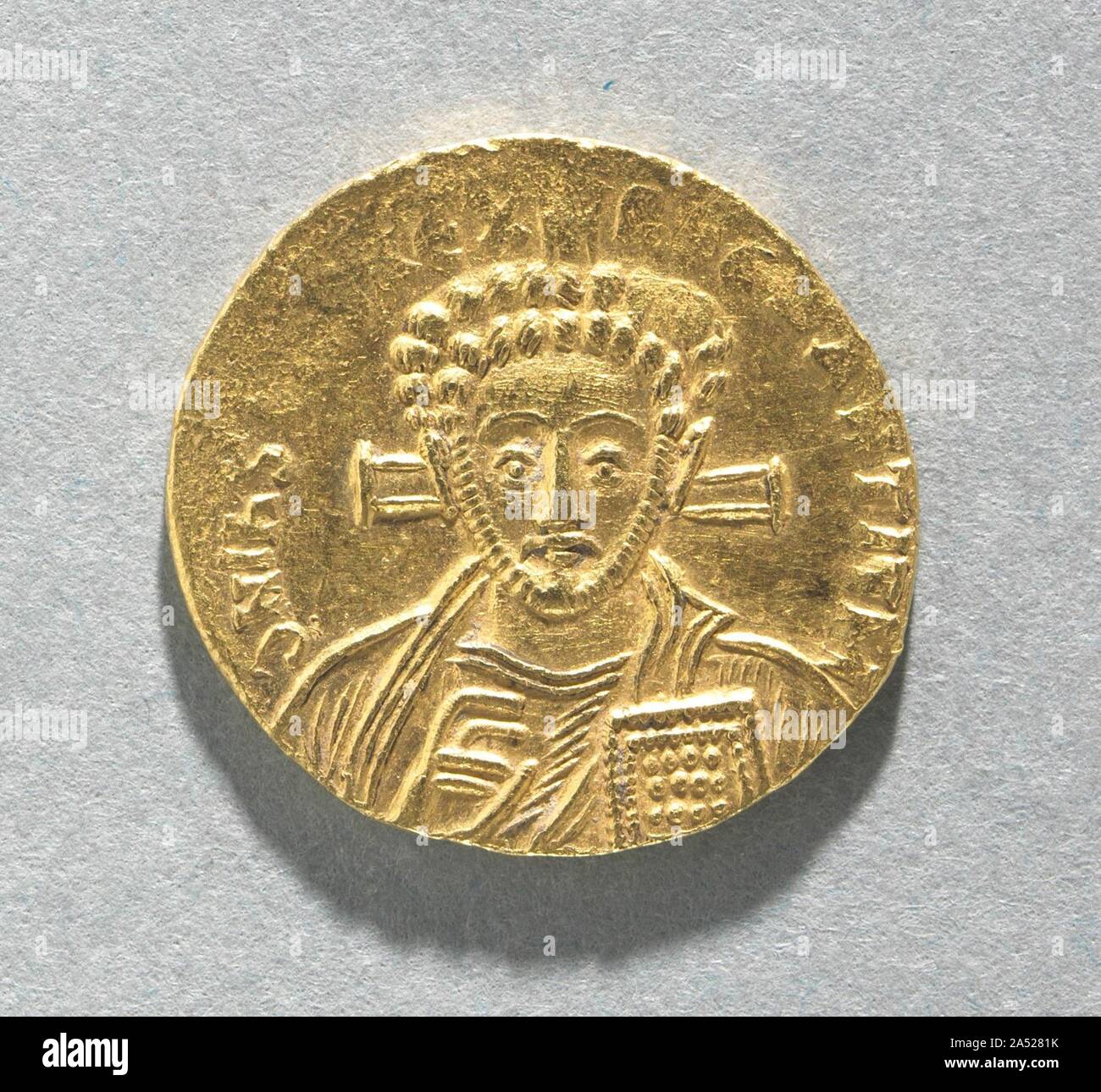 Solidus of Justinian II with Bust of Christ (obverse), 705. Byzantine Gold Coins The vast number of surviving Byzantine coins attests to the level of trade across the empire. Controlled and supervised by the emperor, the producers of coins took care to represent his authority and reflect his stature. Talented artists were recruited to engrave the dies (molds) used for the striking of coins. Emperors increasingly came to include their heirs and co-emperors on their coinage, as well as other family members or even earlier rulers. Coins were recognized, then as now, as small, portable works of ar Stock Photo