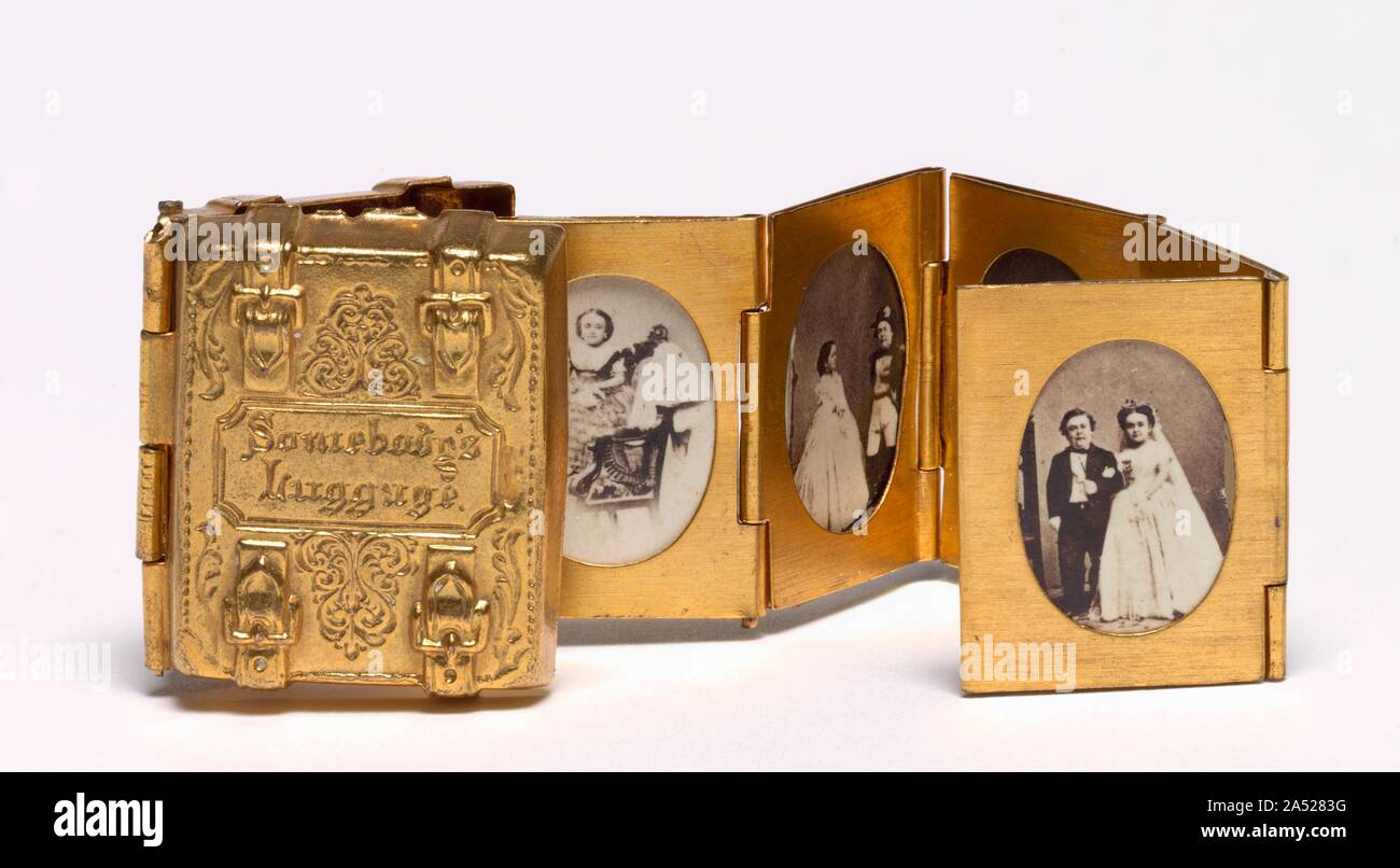 Somebody's Luggage (Miniature Wedding Album of Tom Thumb and Lavinia Warren), c. 1863. This deluxe commercial souvenir commemorates the marriage of &quot;General&quot; Tom Thumb (Charles Sherwood Stratton) and Lavinia Warren, performers at P. T. Barnum&#x2019;s American Museum. Thumb was such a celebrity that the wedding pushed the Civil War off newspapers&#x2019; front pages for days. Cartes-de-visite of the wedding sold in the thousands; Brady even licensed the image to lithographers and other photographers. In one image, Lavinia holds a baby who was borrowed for the photo shoot to suggest h Stock Photo