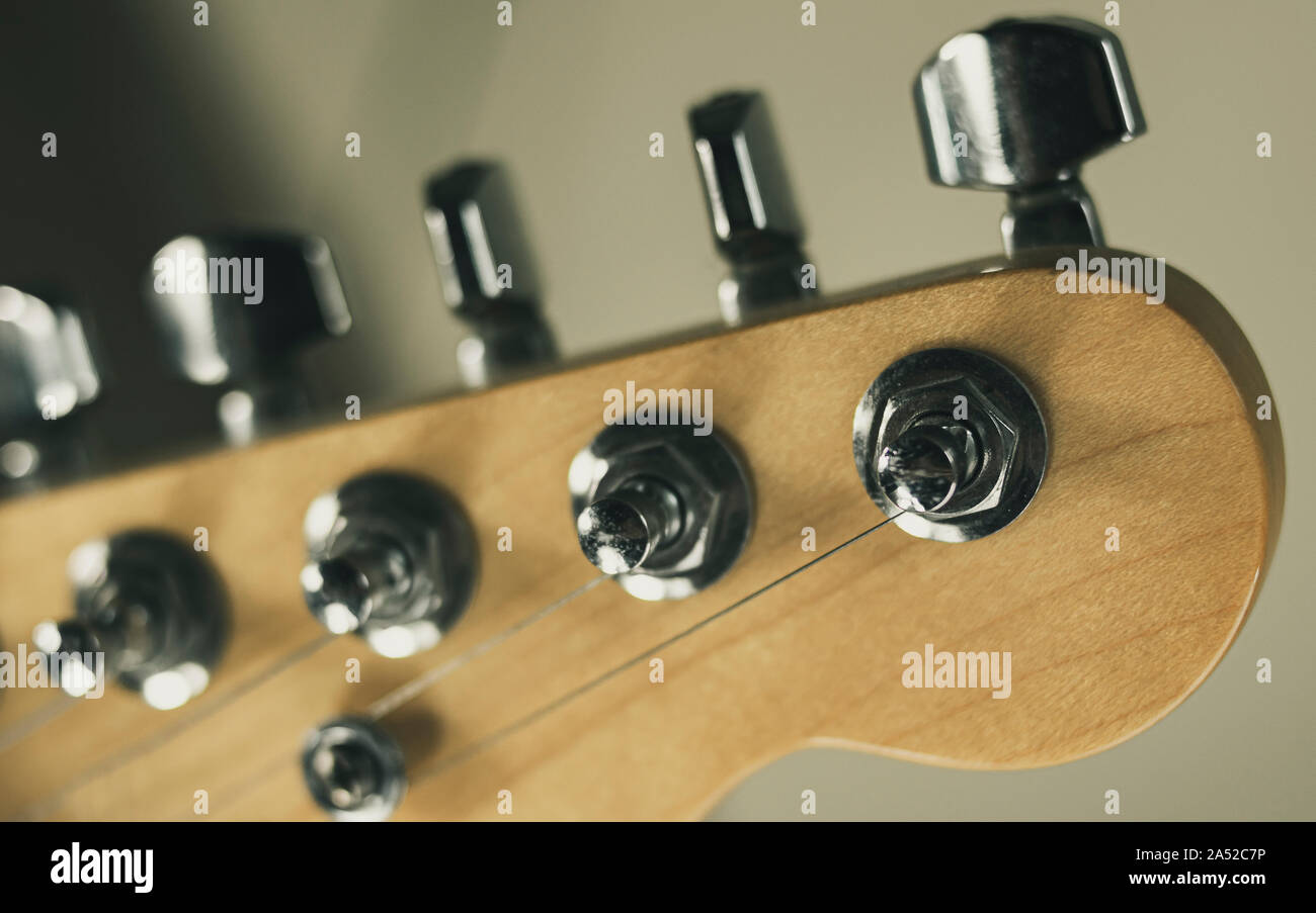 Tuners, strings and Shovel of a standard American classic electric guitar Stock Photo