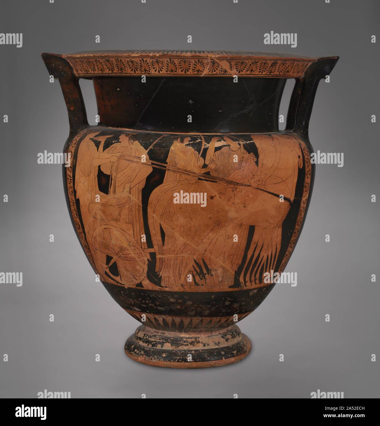 The Cleveland Krater, c. 470-460 BC. Since this column krater is the most important of 12 vases painted by a Greek artist whose name is unknown, the great English vase expert, Sir John D. Beazley, named both the vase and the painter after our city. Other vases by this painter are in New York, Vienna, Paris, and Copenhagen. Front: The scene on this side may represent Hebe, the daughter of Zeus and Hera, on her way to meet her future husband, Herakles. Back: On this side of the vase, drunken revelers return from a symposium, a drinking party at which wine was served from huge vessels like this o Stock Photo
