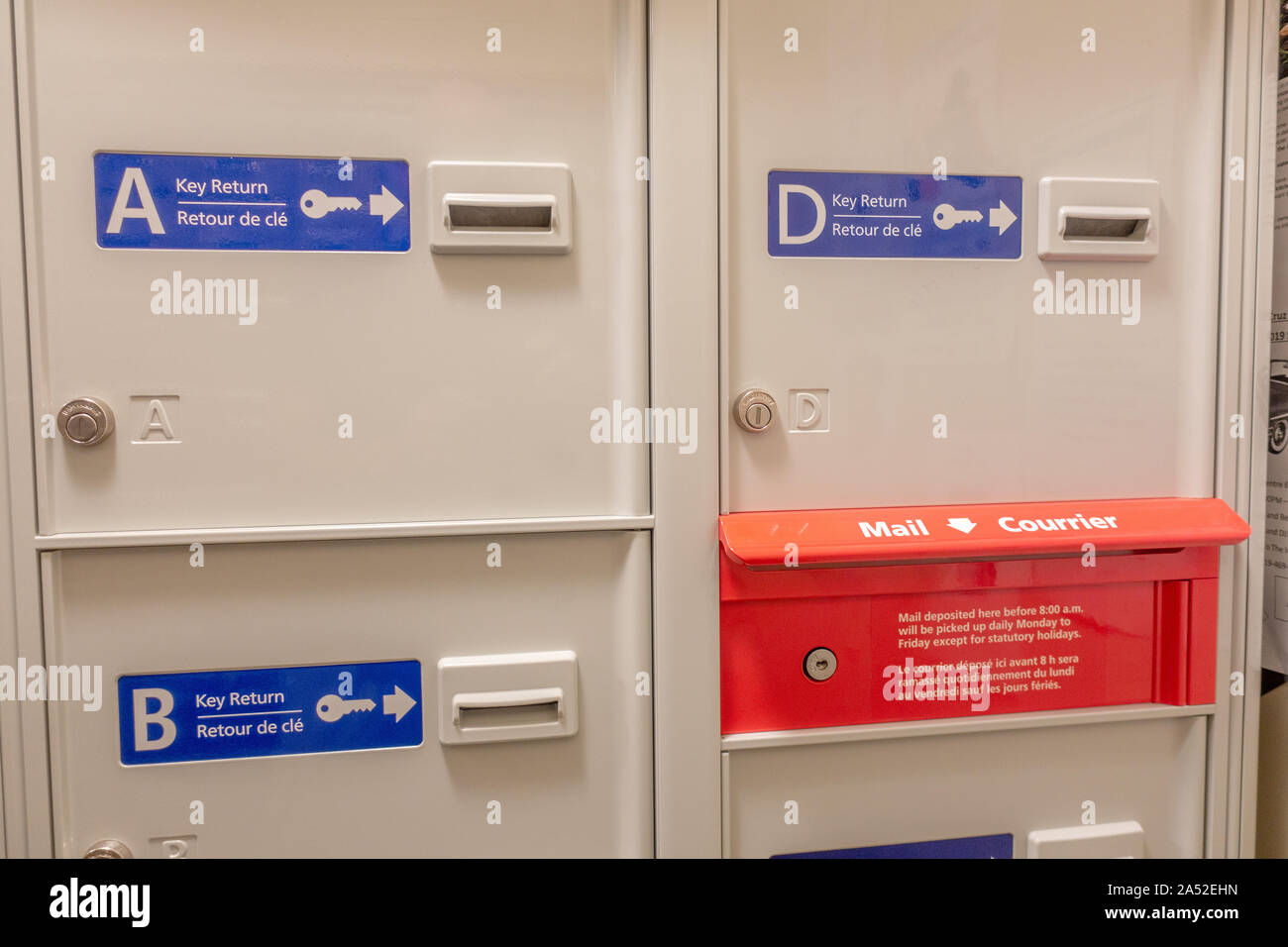 Canada Post Mailboxes Inside An Apartment Building For Large Packets And Parcel Deliveries As Well As A Mail Slot For Posting Letters. Stock Photo