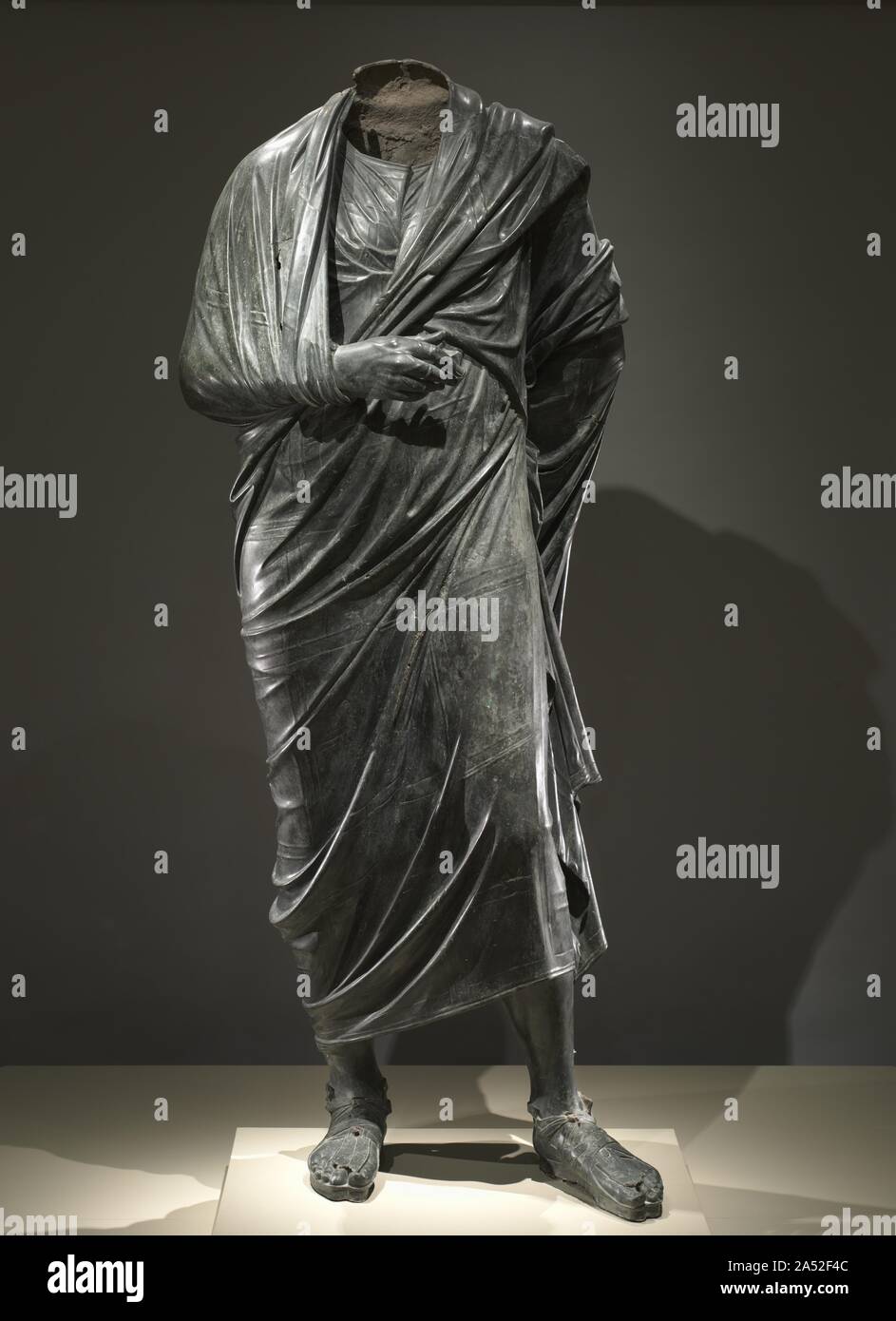 The Emperor as Philosopher, probably Marcus Aurelius (reigned AD 161-180), c. AD 180-200. The extremely high quality and monumental scale of this bronze draped figure suggest that this is an imperial portrait. The pose with left leg forward, right arm raised to the chest, and right hand visible - is identical to several Greek portraits of philosophers. The figure is most probably the Roman emperor Marcus Aurelius, who was a student of Stoicism, a set of Greek philosophical beliefs popular among educated Romans of his day. Marcus Aurelius wrote a collection of philosophical reflections called M Stock Photo