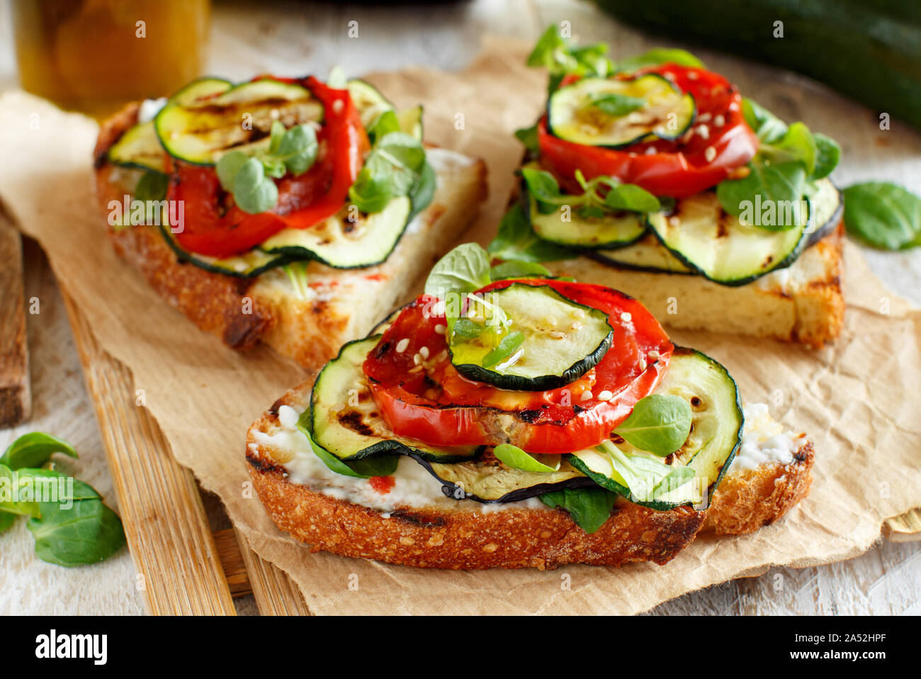 Vegetarian sandwich with fresh cheese, grilled tomatoes, eggplants and