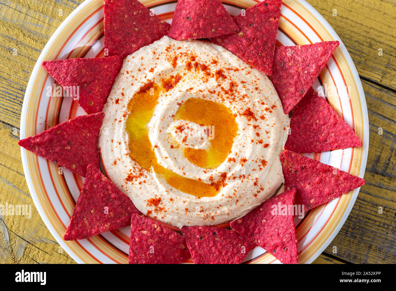 Hummus with tortilla chips top view Stock Photo Alamy
