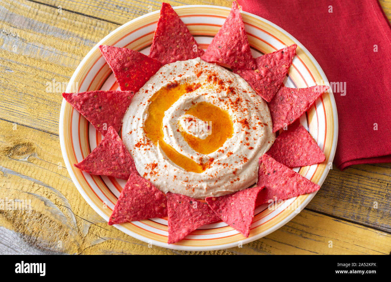 Hummus with tortilla chips top view Stock Photo Alamy