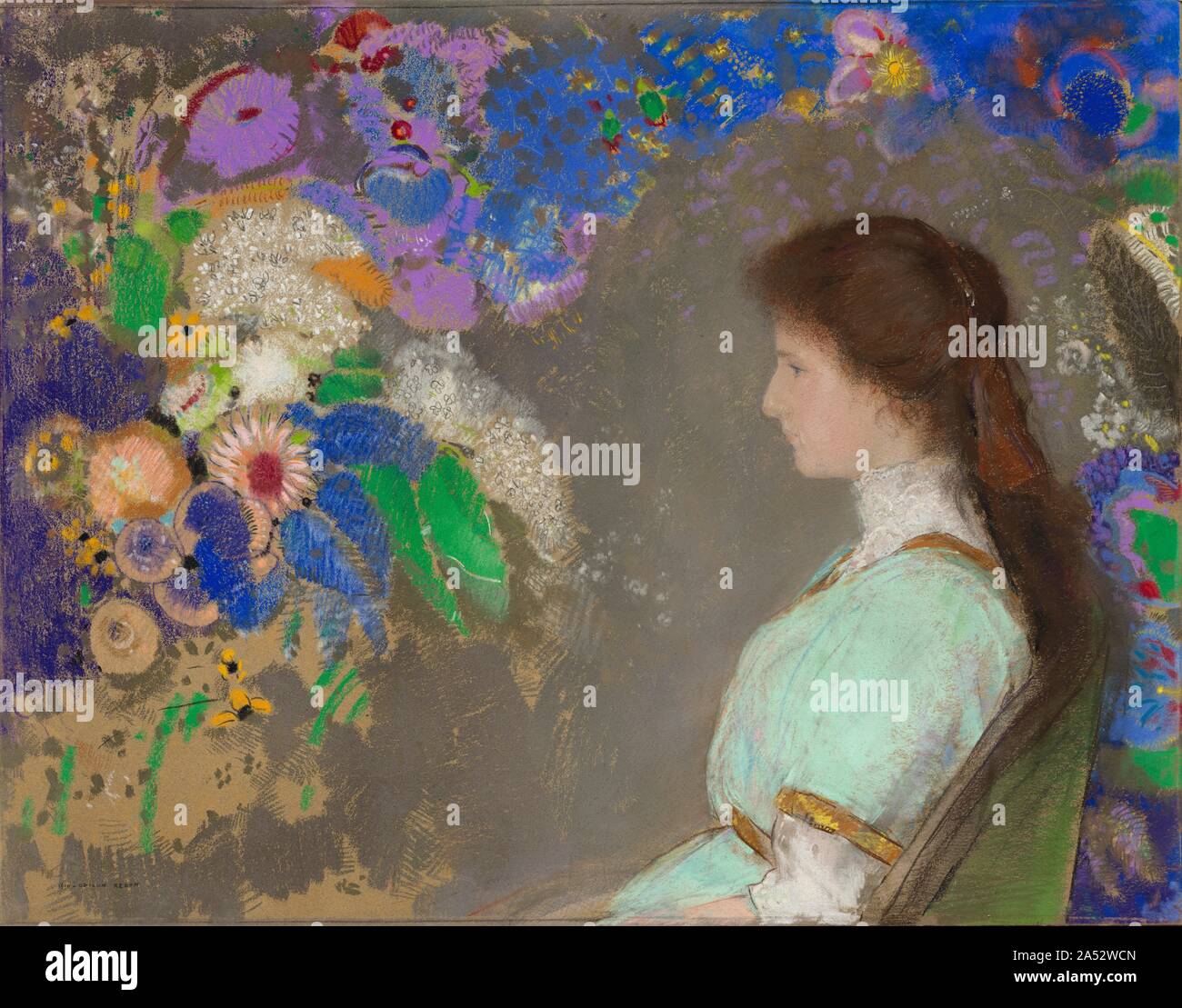 Violette Heymann, 1910. During the last 15 years of Redon&#x2019;s life, his studio was busy with commissions for pastel portraits of women with flowers. Here, the adolescent niece of the Paris collector Marcel Kapferer is enveloped in a cloudlike bouquet of azure, purple, and white blossoms, with iridescent colours and a velvety texture that evoke butterfly wings. Stock Photo