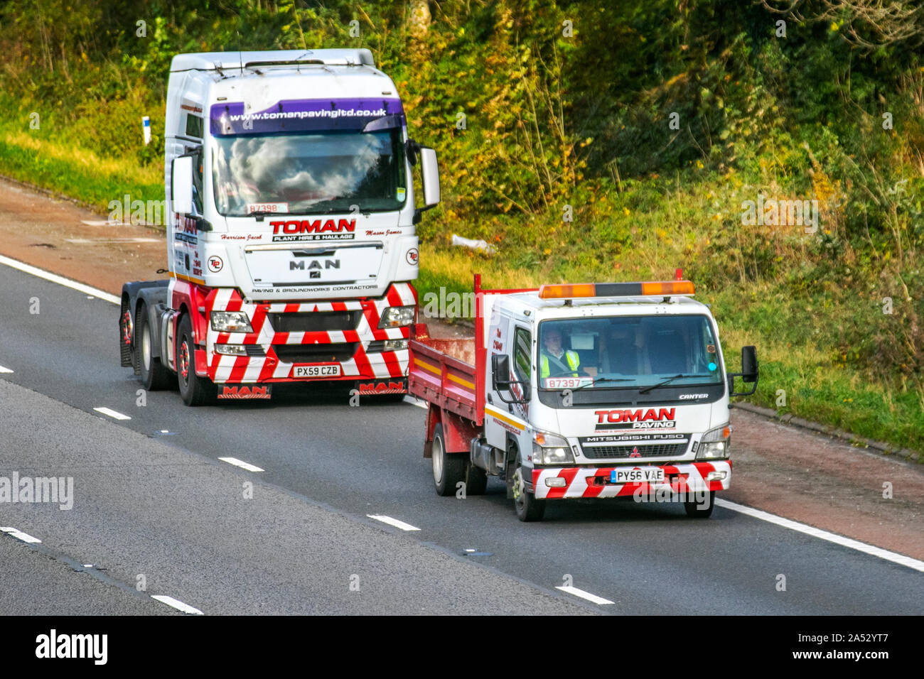 Toman Plant Hire & Haulage; Motorway heavy bulk Haulage delivery trucks, haulage, lorry, transportation, fleet tractor unit power train, truck, special cargo, Scania vehicle, delivery, transport, industry, freight on the M6 at Lancaster, Stock Photo