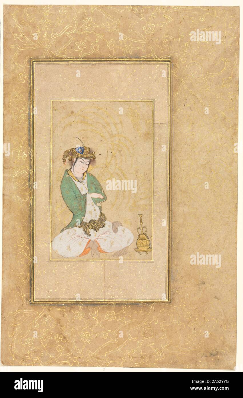 Youth Seated by a Willow; Single Page Illustration, c. 1600-1650. Single polychrome paintings of elegantly clad youth were produced in considerable number during the 1600s, primarily for people with means who collected them and had them mounted in albums. Instead of functioning as portraits, the images of these courtly figures express ideals of youth and beauty. This young man&#x2019;s lavish sash and turban enriched with costly gold thread proclaim his high status. Stock Photo
