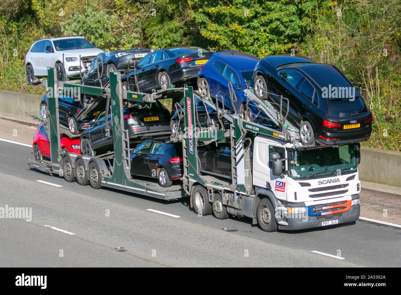 BCA British Car Auctions car transporter, Lorries & Trucks, shipping freight, heavy haulage, lorry logistics, collection and deliveries, Scania delivery transport vehicles on the M6 at Lancaster, UK Stock Photo