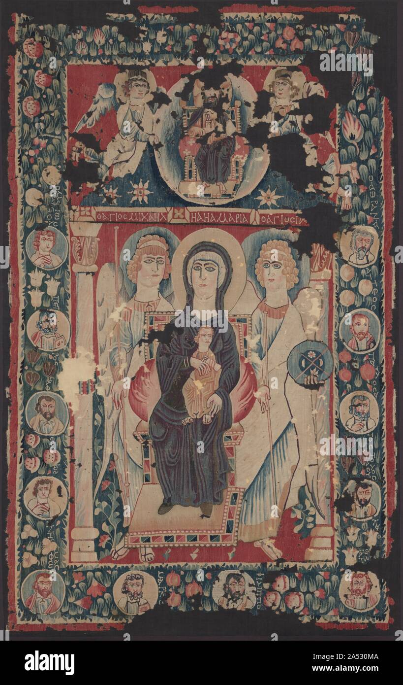 Icon of the Virgin and Child, 500s. This tapestry glorifying the Virgin Mary is among the rarest objects in the museum&#x2019;s collection. In a composition borrowed from imperial Byzantine art, Mary is shown seated on a jeweled throne with the Christ child and flanked by archangels Michael and Gabriel. Above, Christ appears in a radiant light supported by two angels. Portraits of the apostles, identified in Greek, appear in the surrounding wreath symbolizing eternal life. This portable sacred textile was presumably displayed at the front of a public or private place of worship. This unique ta Stock Photo
