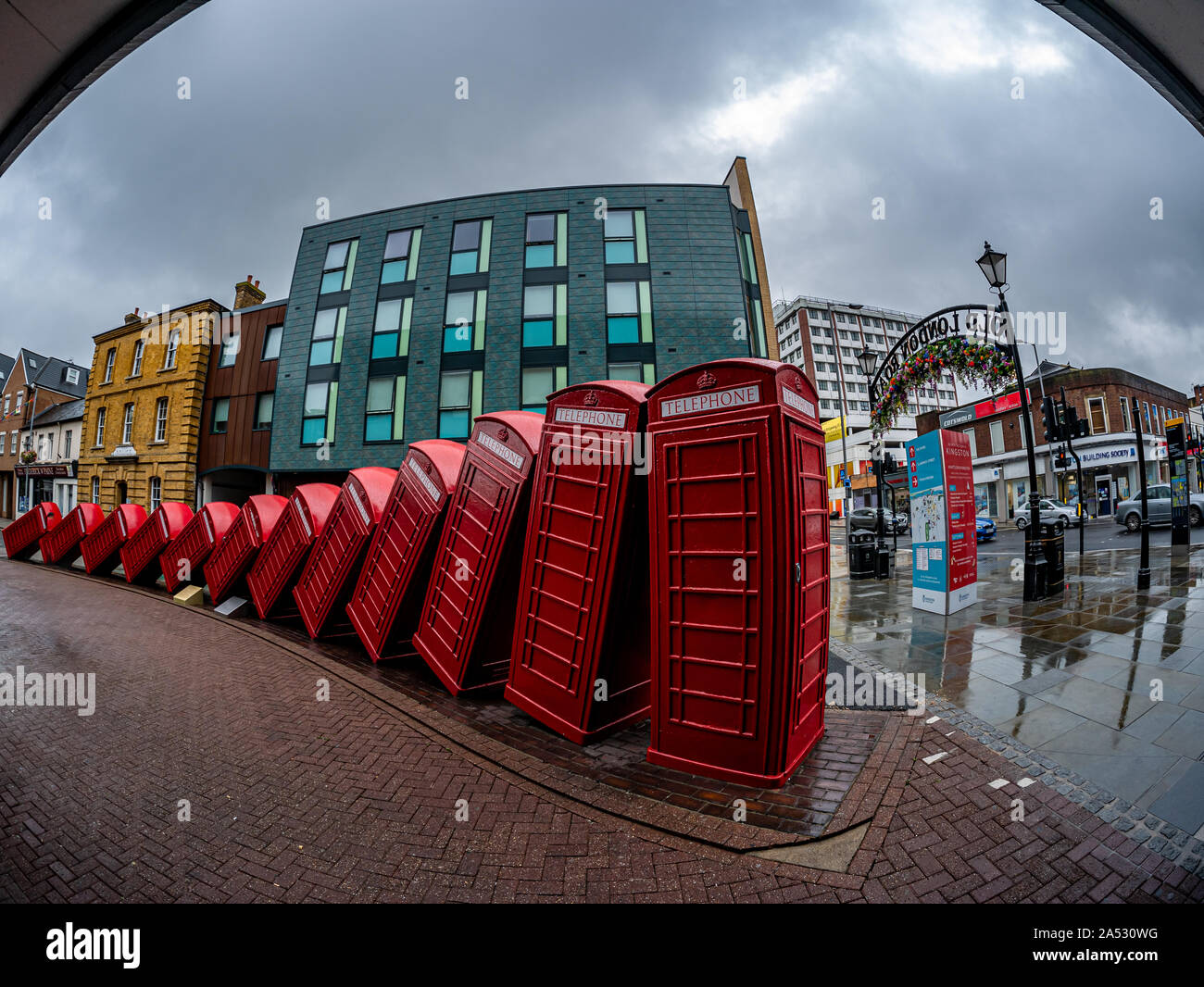 London, England, Un ited Kingdom - August 1, 2019: Red telephone booth symbols of England in the main market square of Kingston upon Thames city Stock Photo